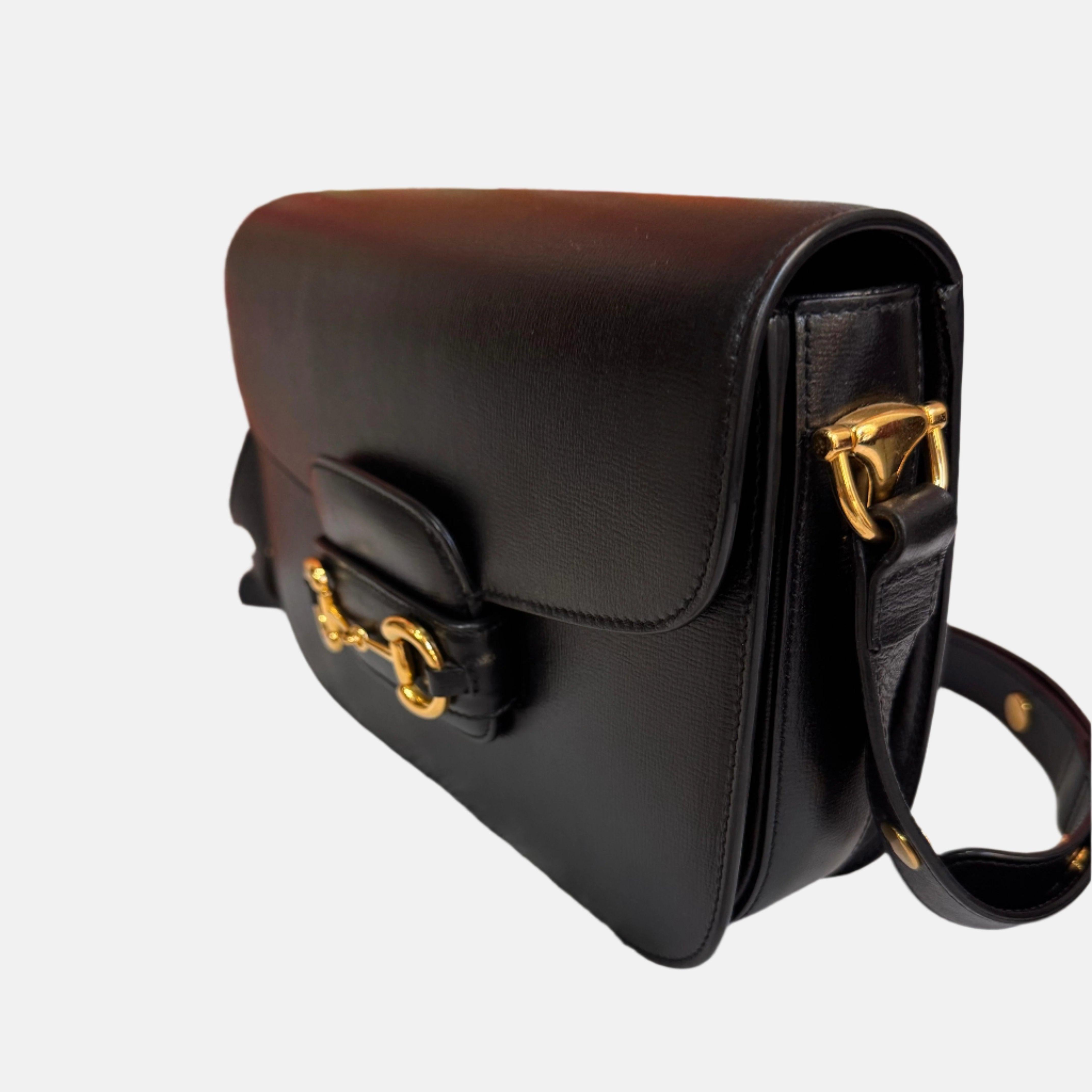 Gucci 1955 Horsebit Bag Small Black Leather
 These are professional photos of the actual bag offered
 Made from premium calfskin leather, this Gucci Horsebit 1955 shoulder bag is a must-have for any fashion enthusiast. The renowned gold-tone Gucci
