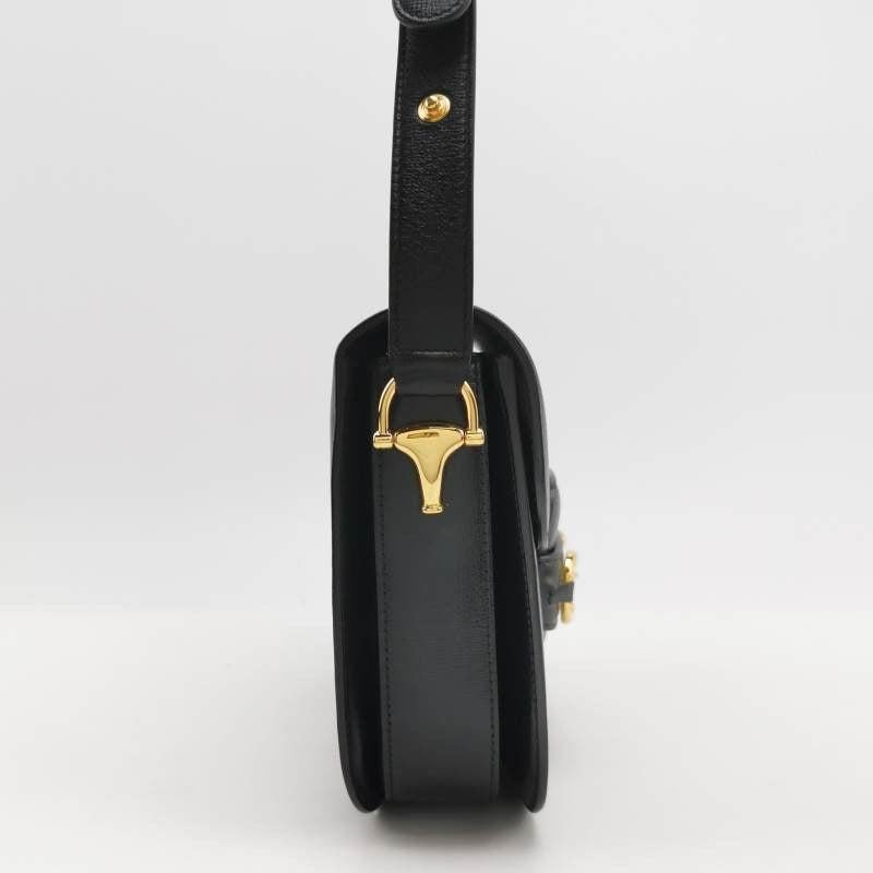 Gucci 1955 Horsebit Bag Small Black Leather
 These are professional photos of the actual bag.
 Made from premium calfskin leather, this Gucci Horsebit 1955 shoulder bag is a must-have for any fashion enthusiast. The renowned gold-tone Gucci Horsebit
