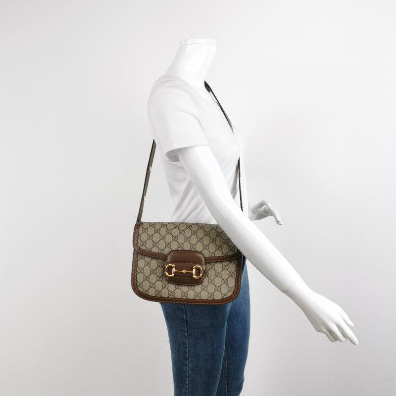 Gucci 1955 Horsebit Bag Small Brown Leather and GG Monogram Canvas
 These are professional photos of the actual bag.
 Made from premium calfskin leather and the iconic GG monogram canvas, this Gucci Horsebit 1955 shoulder bag is a must-have for any