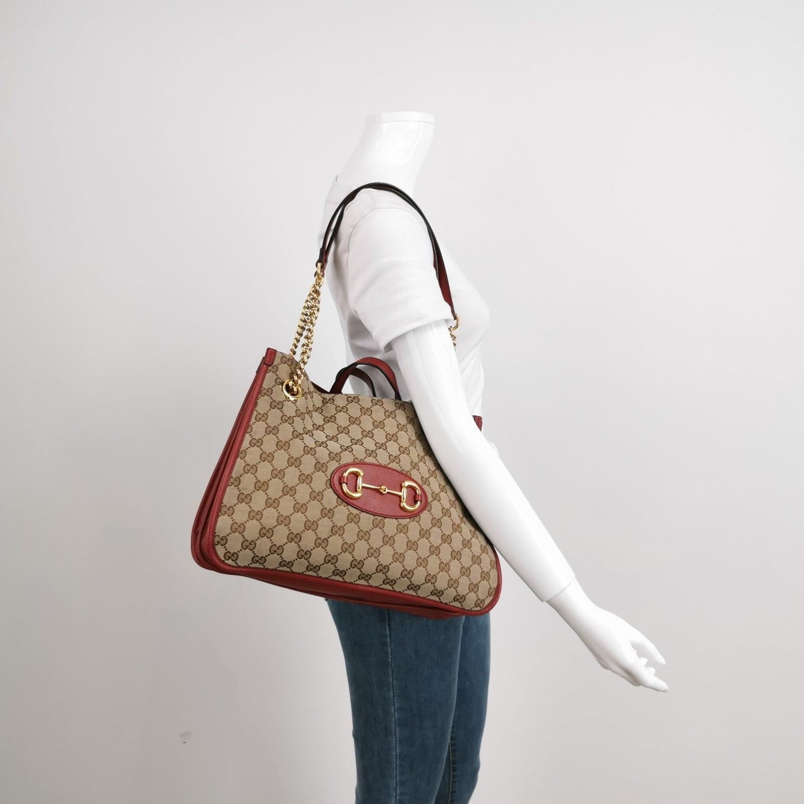 Gucci 1955 Horsebit Chain Tote Red Leather and Monogram Canvas These are professional photos of the actual bag. 
 
 Made from premium calfskin leather and monogram canvas, this Gucci Horsebit 1955 Tote bag is a must-have for any fashion enthusiast.
