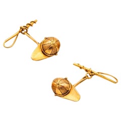 Gemelos GUCCI 1960 con motivos de jinetes y sombreros en oro amarillo macizo de 18 quilates