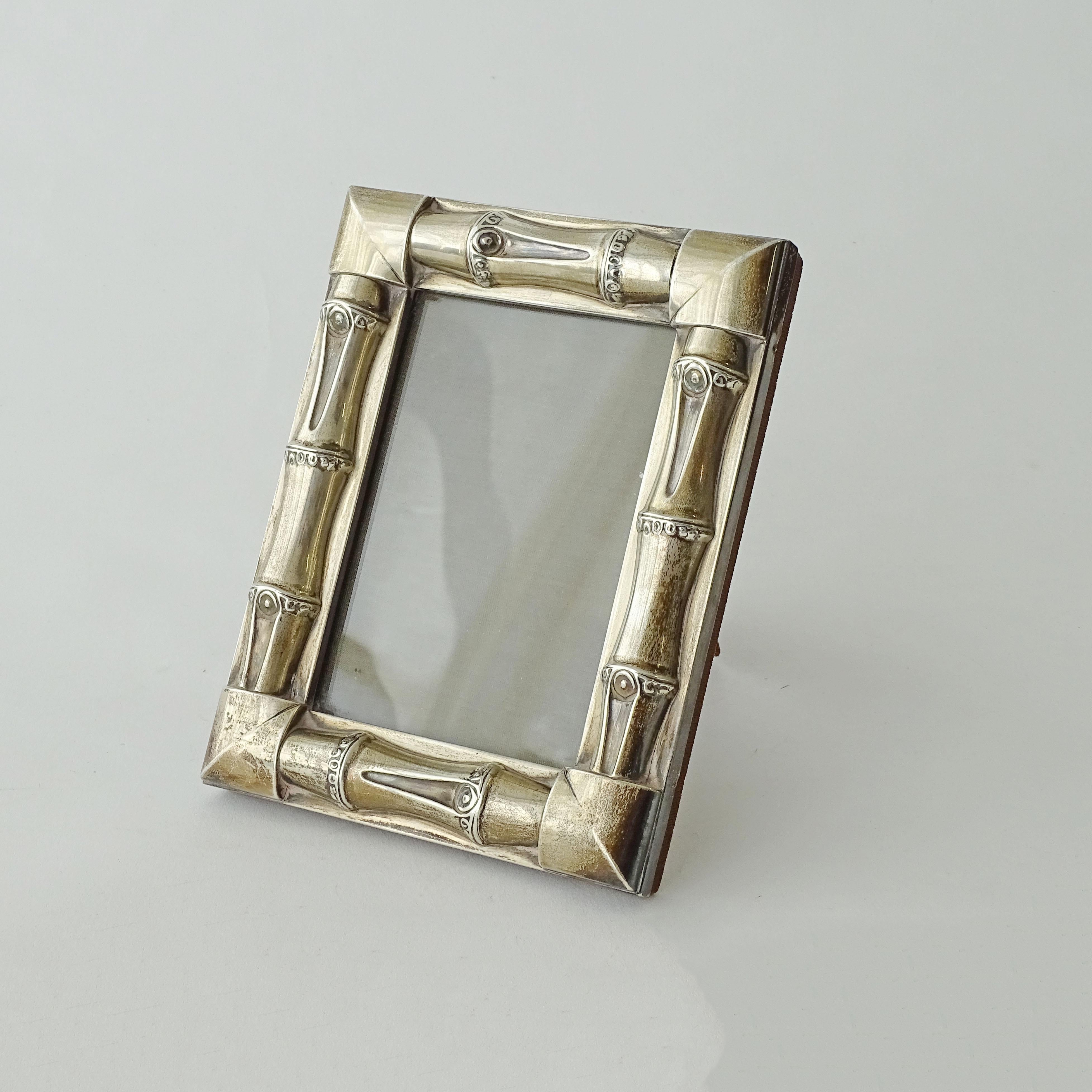 Rare Gucci 1960s Silver Bamboo Picture Frame.
Made in Italy, 925 silver. Silver makers mark for silversmiths Kohler and Schaefer of Milan.
The foot on the back is designed so that the frame can sit either portrait or landscape.
Picture size is 13 x