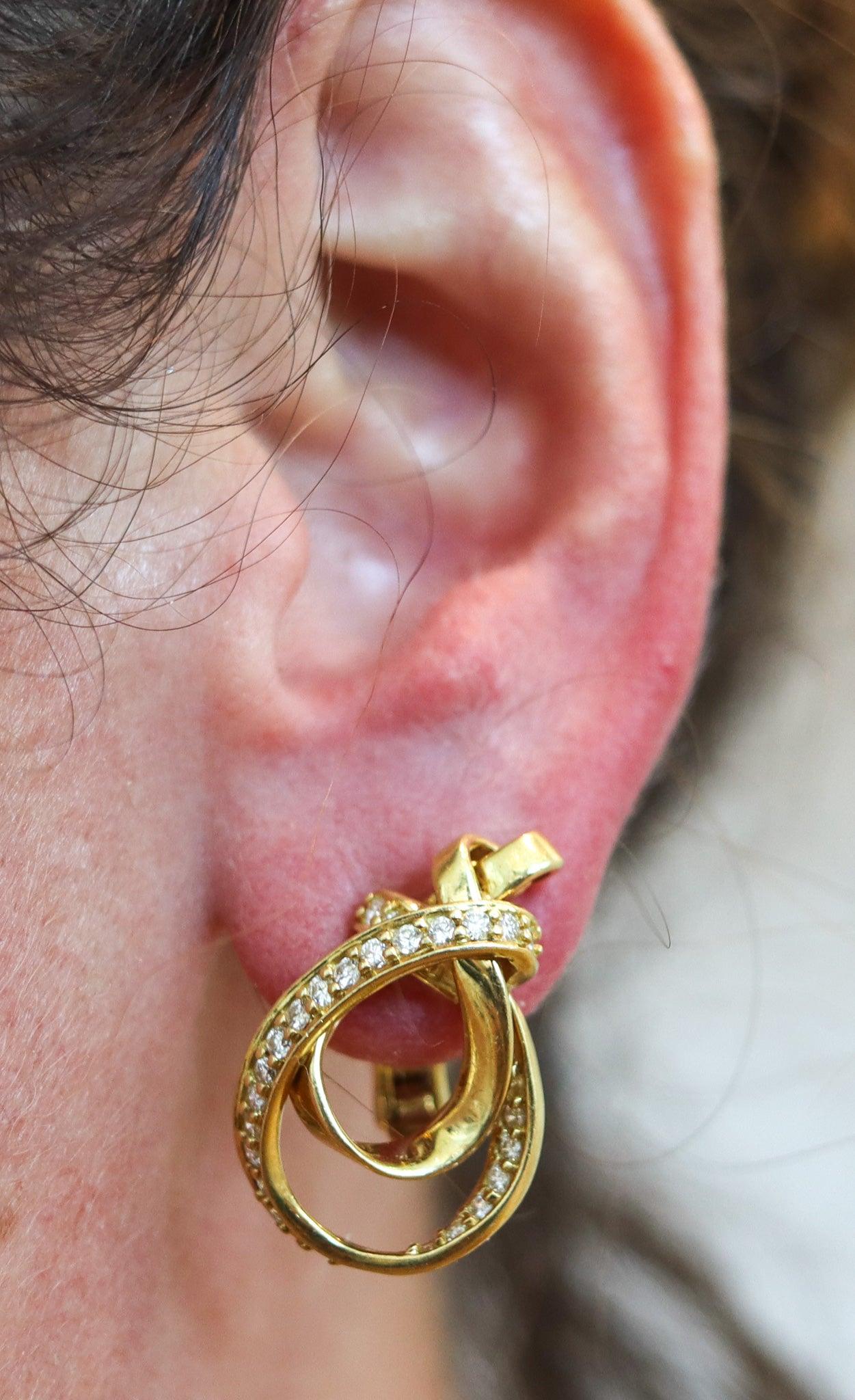 Vintage clips-on earrings designed by Gucci.

These are a very rare vintage pair of earrings created in Firenze Italy by the fashion luxury house of Gucci, back in the 1970. The clips-on earrings were designed as a left and right with