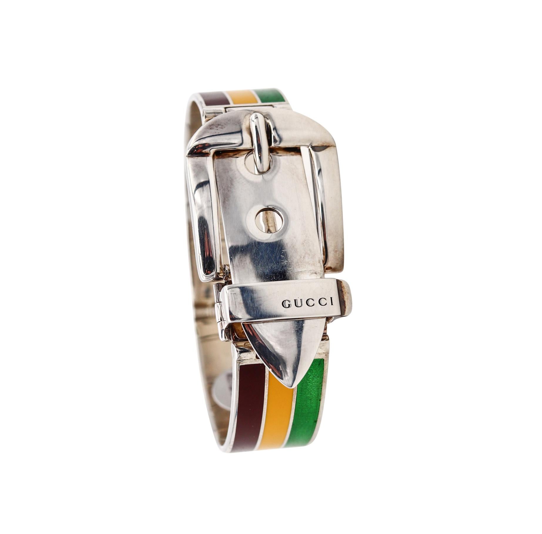 Enameled buckle bracelet designed by Gucci.

Rare vintage buckle bracelet created by the Gucci house in Milano, circa 1970's. This iconic bracelet was crafted in solid .925/,999 sterling silver and is embellished with applications of Green, Brown