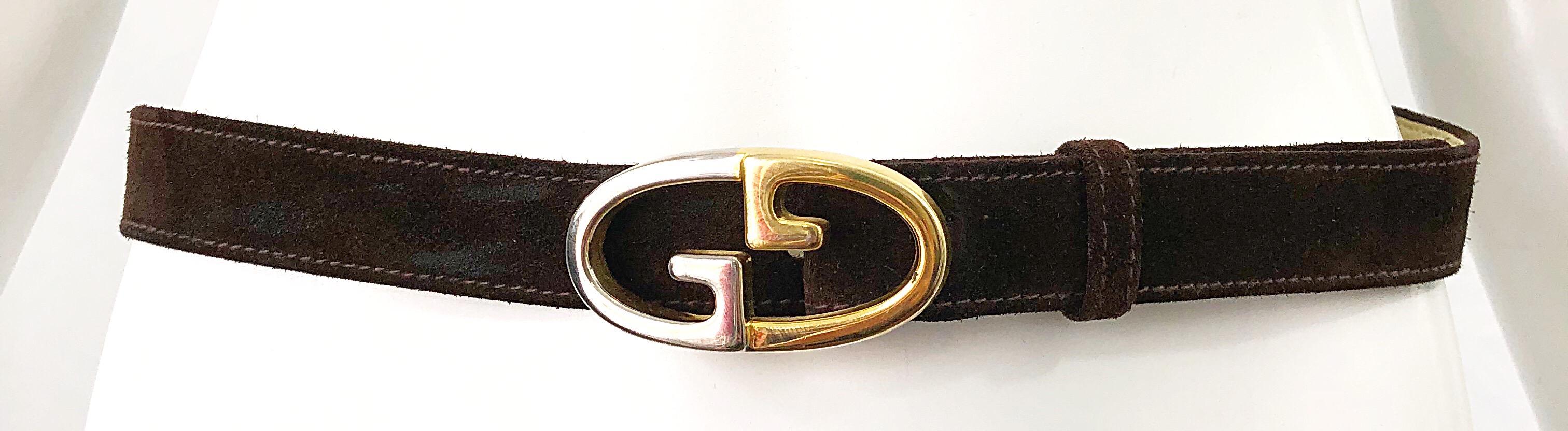 Iconic 1970s GUCCI women's brown suede leather thin belt ! Two tone silver and gold hardware matches anything. Can be paired with jeans, shorts, a skirt, or over a dress.
In great conditon 
Made in Italy
Approximatley Size Small -
