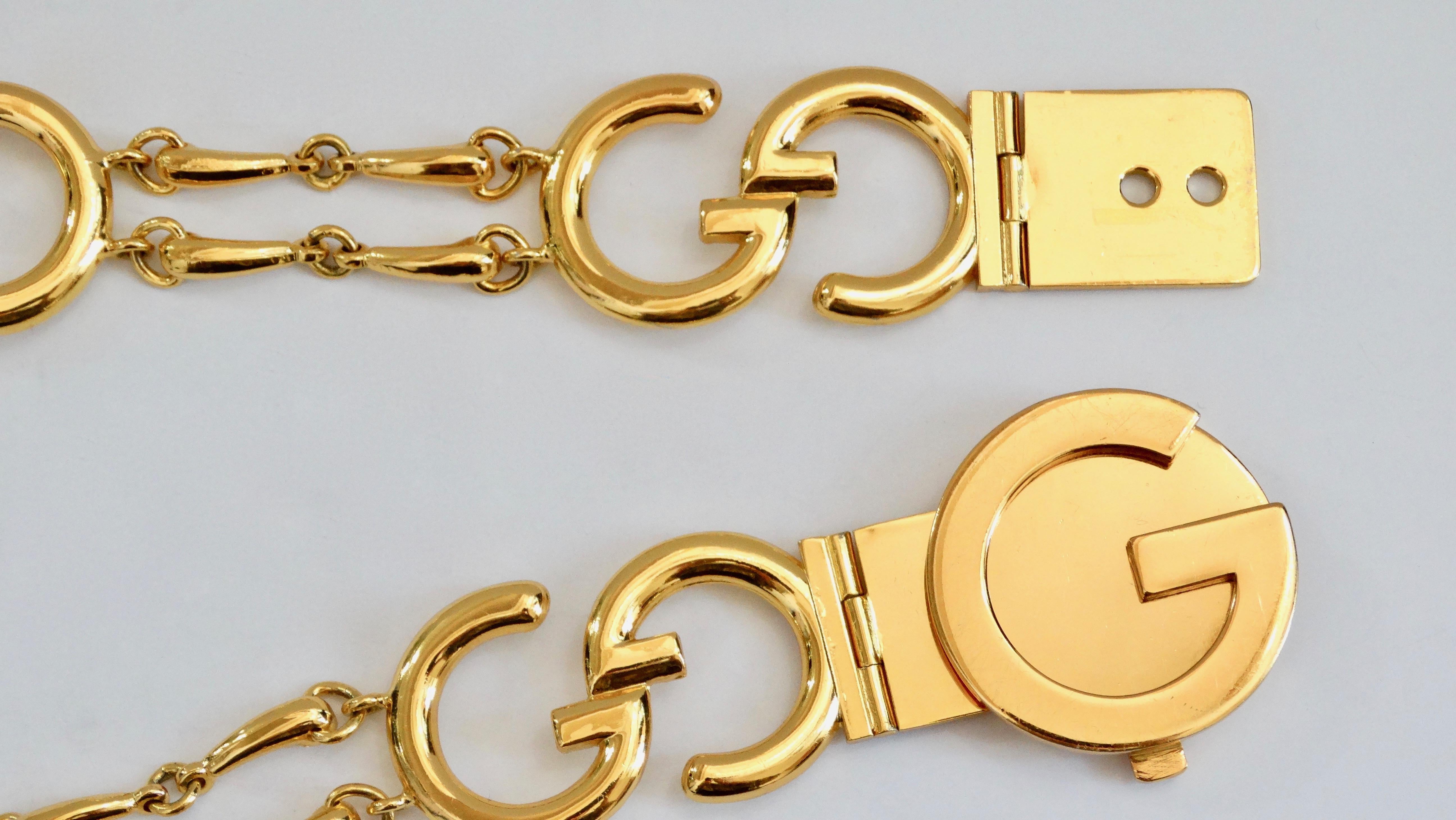 Elevate your looks with this amazing and rare Gucci belt! Circa 1970s, this chain belt is gold plated and features the signature Gucci 'GG' logo which are connected by horse bits. Buckle is a large 'G' that acts as a latch closure. The perfect belt