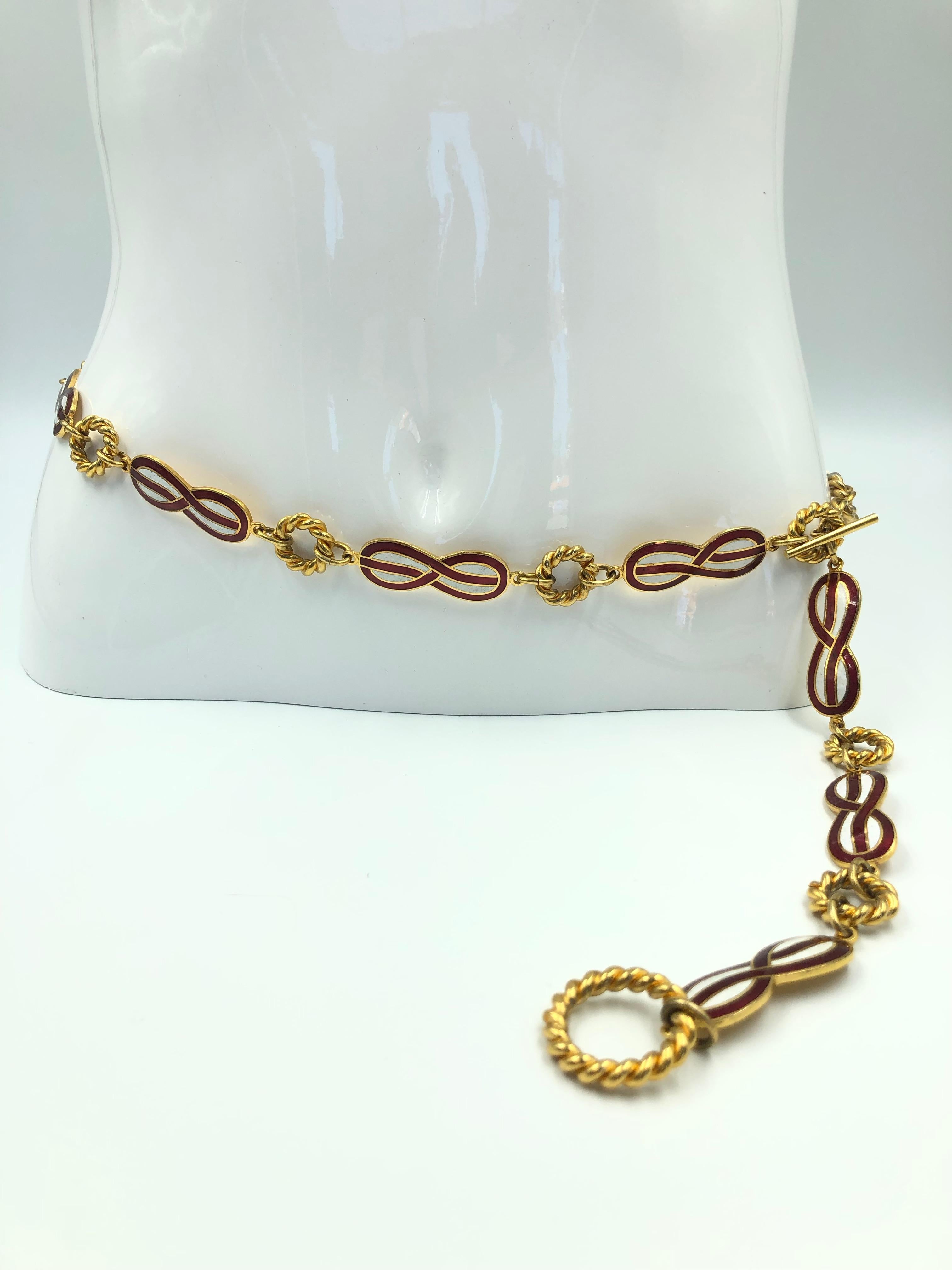 Gucci 1970's Infinity Symbol Red & White Enamel and Gold Tone Chain Belt

Length: 36
