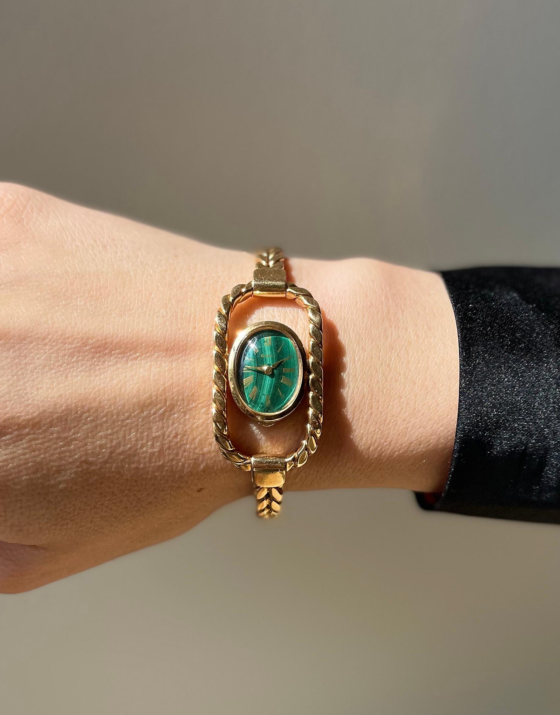 Vintage circa 1970s Gucci wrist watch in 18k gold, featuring malachite dial. The bracelet will fit an approx. 7