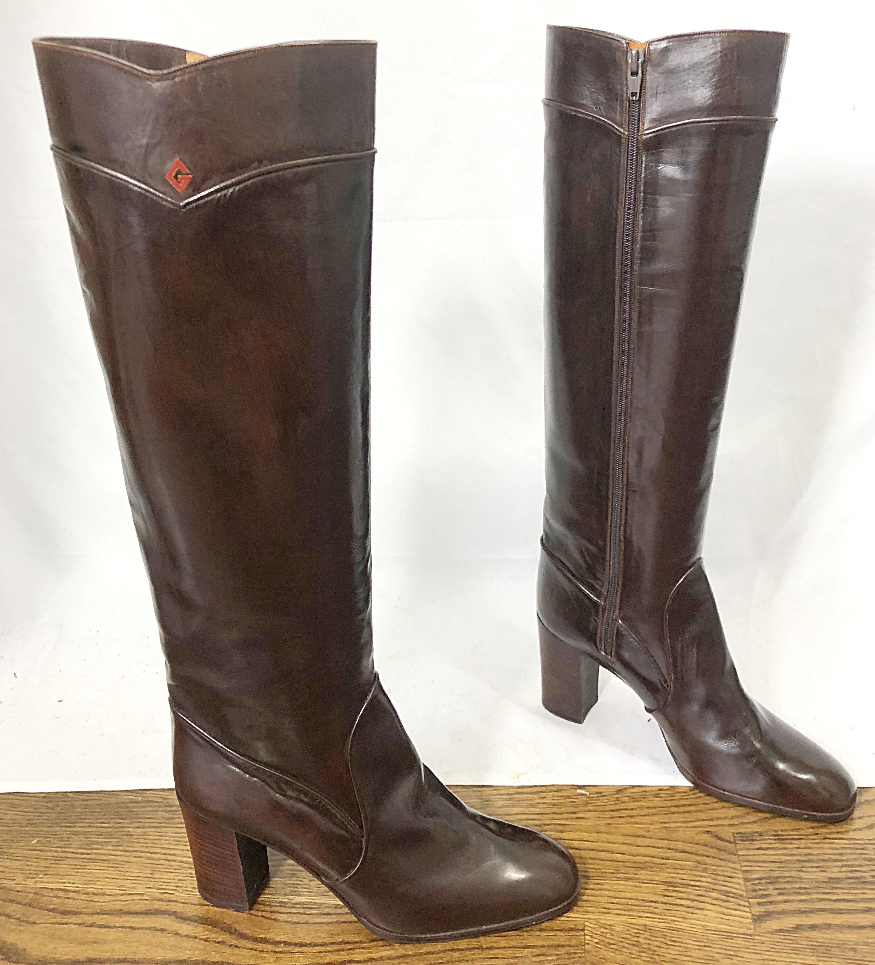 Chic 1970s vintage GUCCI Size 8.5 chocolate brown leather knee high heeled boots ! Features the perfect shade brown with the red G logo at each outter calf. Hidden zipper up the inside. Sturdy block heels are comfortable to wear all day. 
Can easily