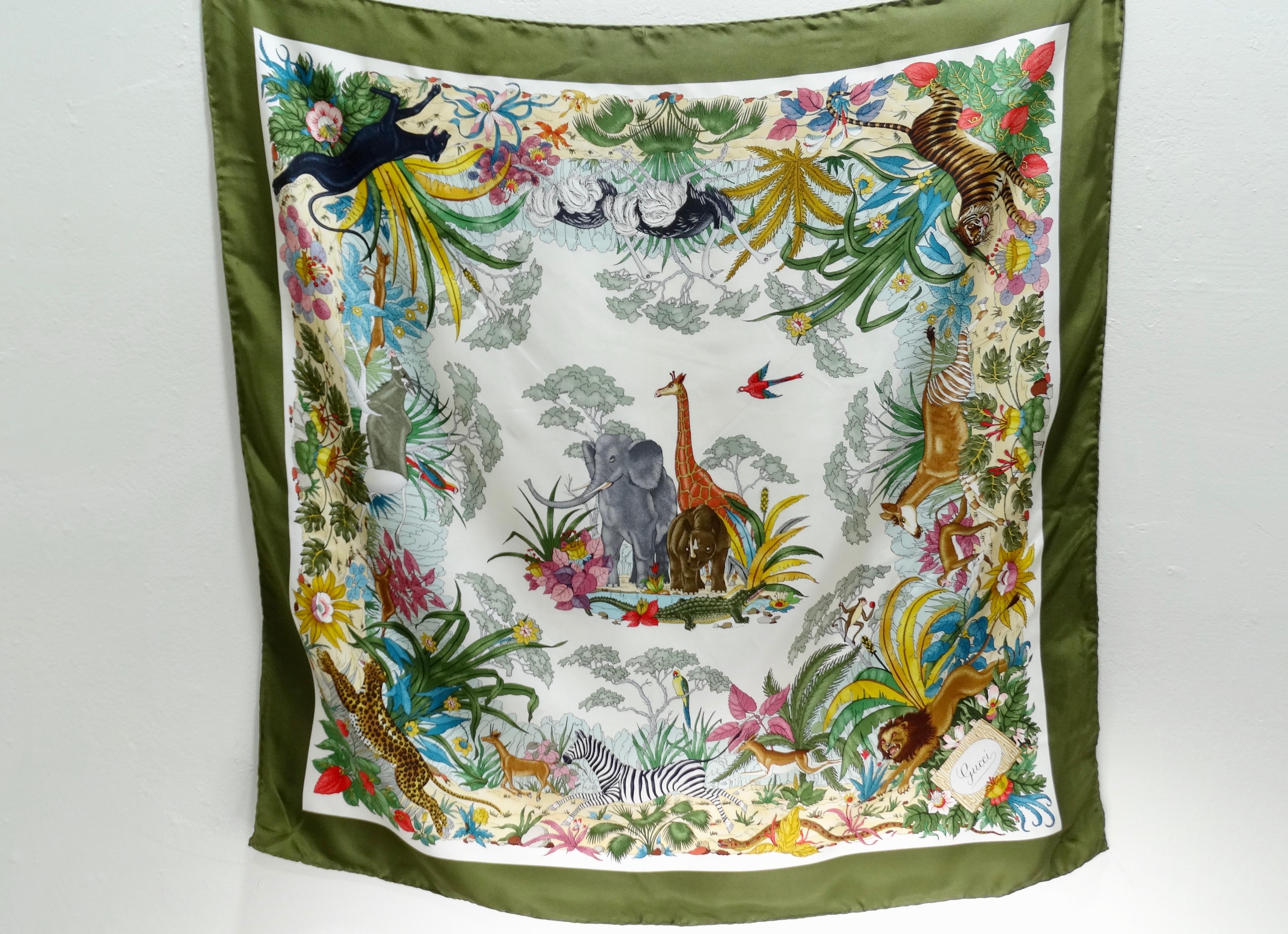 Everyone need a Gucci scarf in their wardrobe! Circa 1970s, this gorgeous and rare Gucci silk scarf features a jungle motif designed by Vittorio Accornero. Motif includes a variety of jungle animals such as Giraffes, birds, zebras and tropical