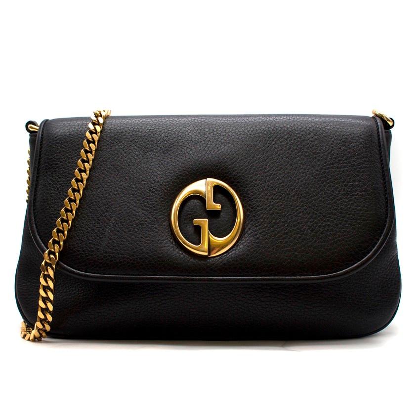 Gucci 1973 Bucharest black leather cross-body bag

- Black, grained leather 
- gold-tone metal chain shoulder strap 
- Front flap, GG logo plaque 
- Internal zip pocket 
- Beige suede lining
- Serial code: 251820 492045

Approx. 
Length: