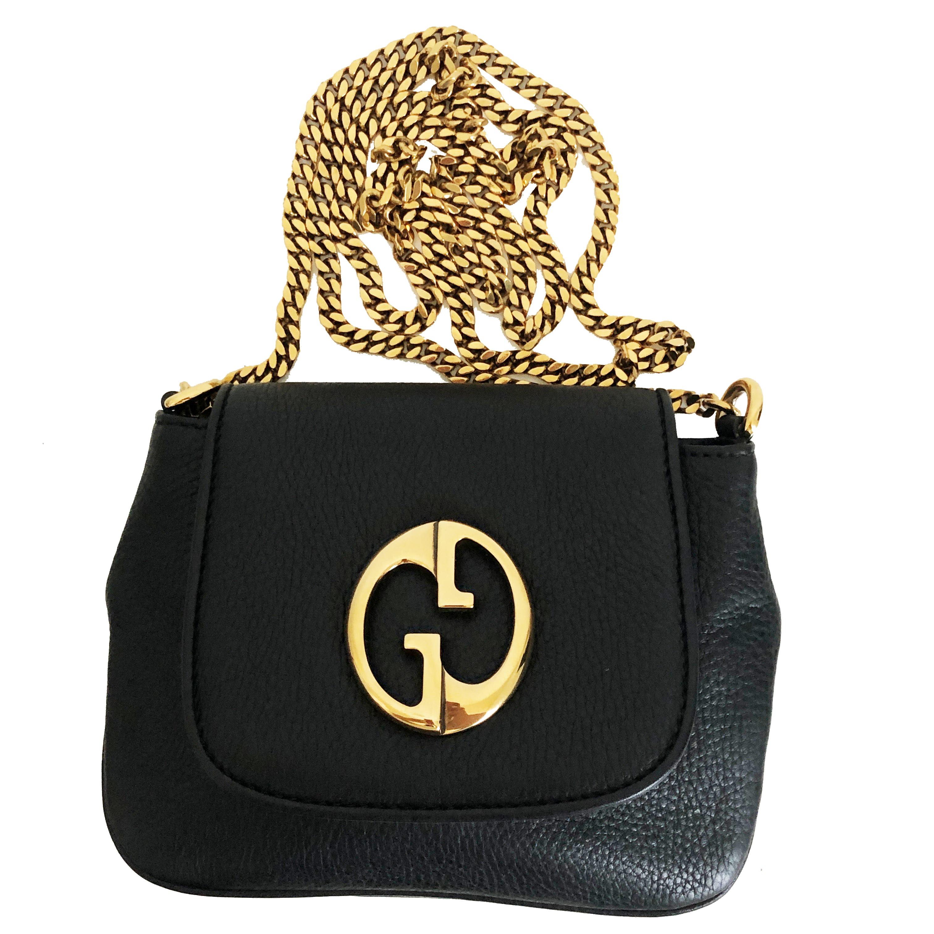Authentic, NWOT Gucci 1973 Shoulder Bag Cross Body, made from black pebbled leather and released in 2012. Comes with copy of receipt and dust bag. Interior lined in sueded fabric with one slip pocket. Authenticated by ENTRUPY, and we'll include a