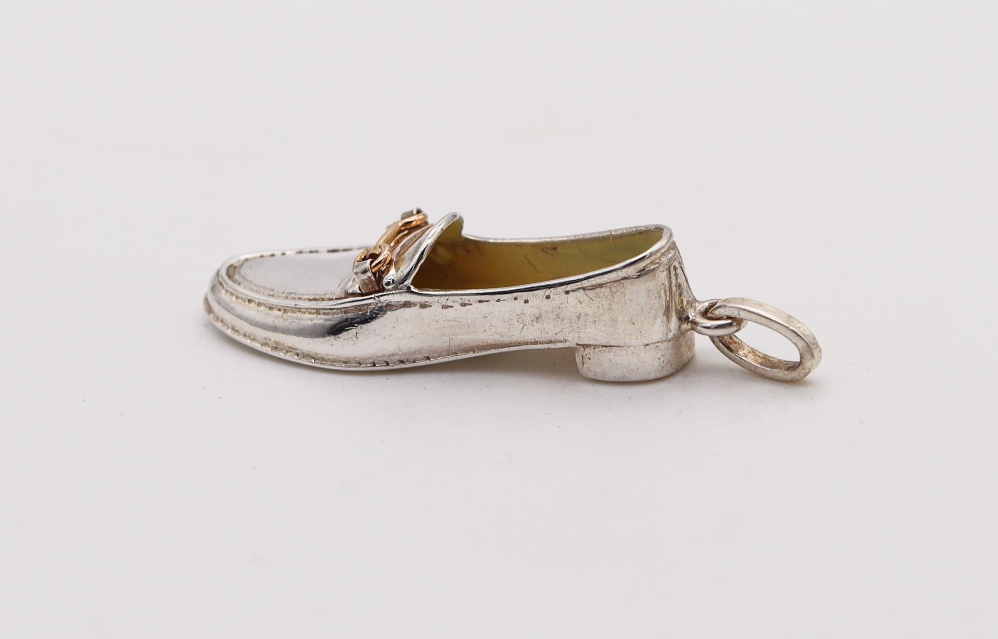 Pendant charm designed by Gucci.

Beautiful pendant-charm, created in Firenze Italy by the fashion house of Gucci, back in the 1980's. This pendant has been made as a miniature in the shape of the iconic loafers' shoes in solid .925/.999 sterling