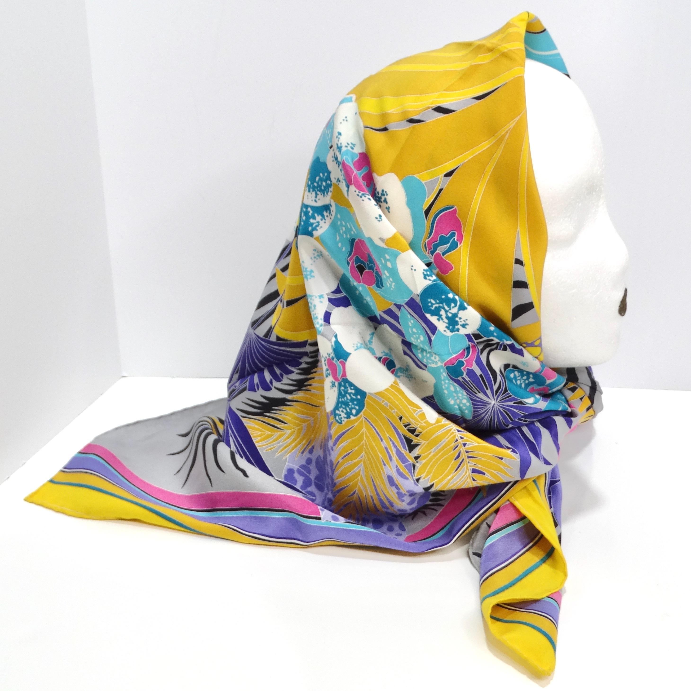 Introducing the Gucci 1980s Floral Silk Scarf, a stunning and vibrant accessory that encapsulates the bold and eclectic style of the 1980s. Crafted from luxurious silk, this scarf features a captivating floral print mixed with multicolor stripes and