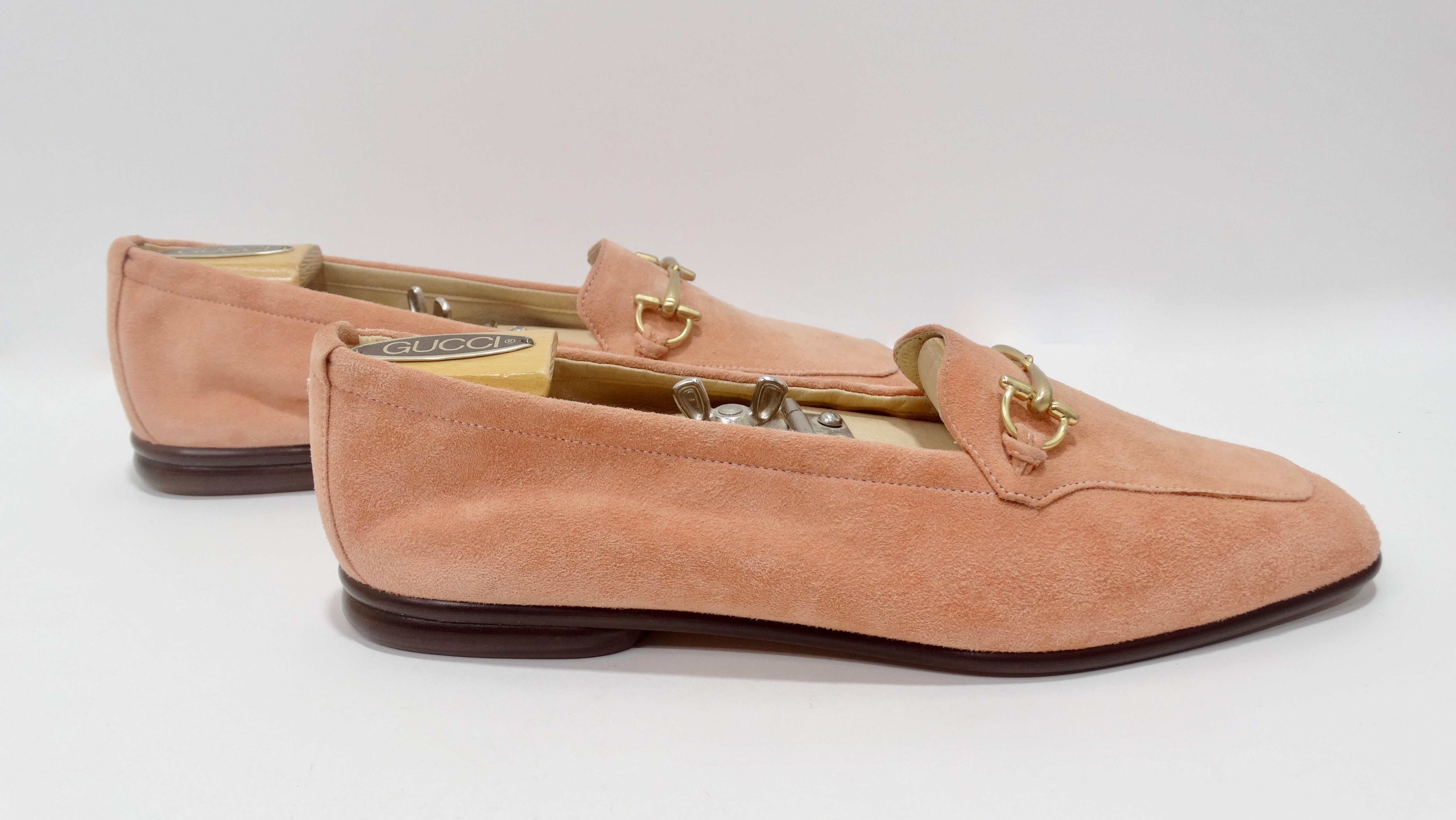 Snag yourself these adorable classic Gucci loafers! Circa 1980s, these loafers are crafted from pink suede and feature the signature Gucci horse-bit in gold toned hardware across the upper and dark wood soles. Stamped Gucci Made in Italy and are