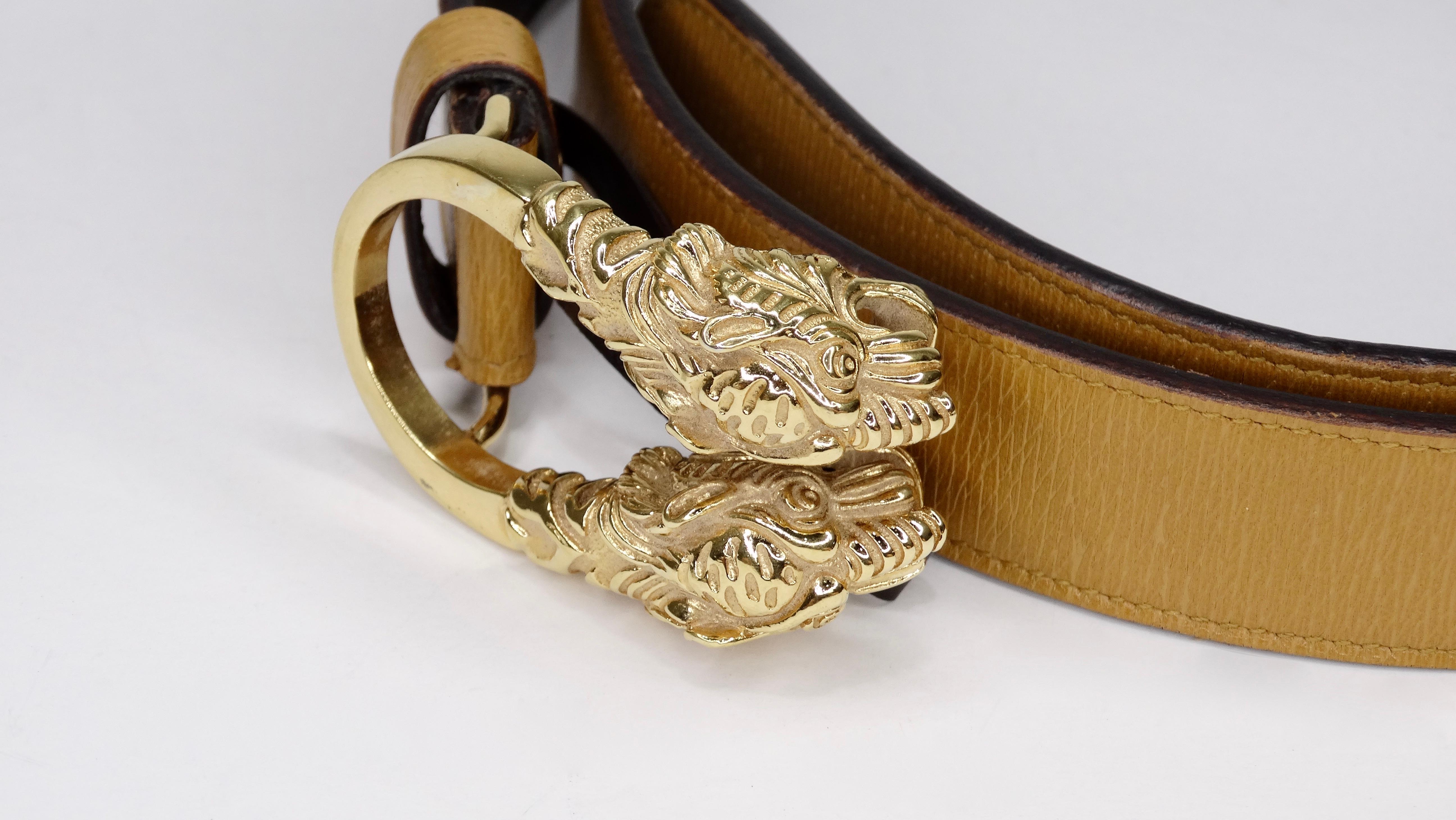 Score yourself a piece of classic Gucci with this amazing belt! Circa 1980s, this light brown leather belt features a Dionysus antiqued gold buckle-a unique detail referencing the Greek god Dionysus, who in myth is said to have crossed the river