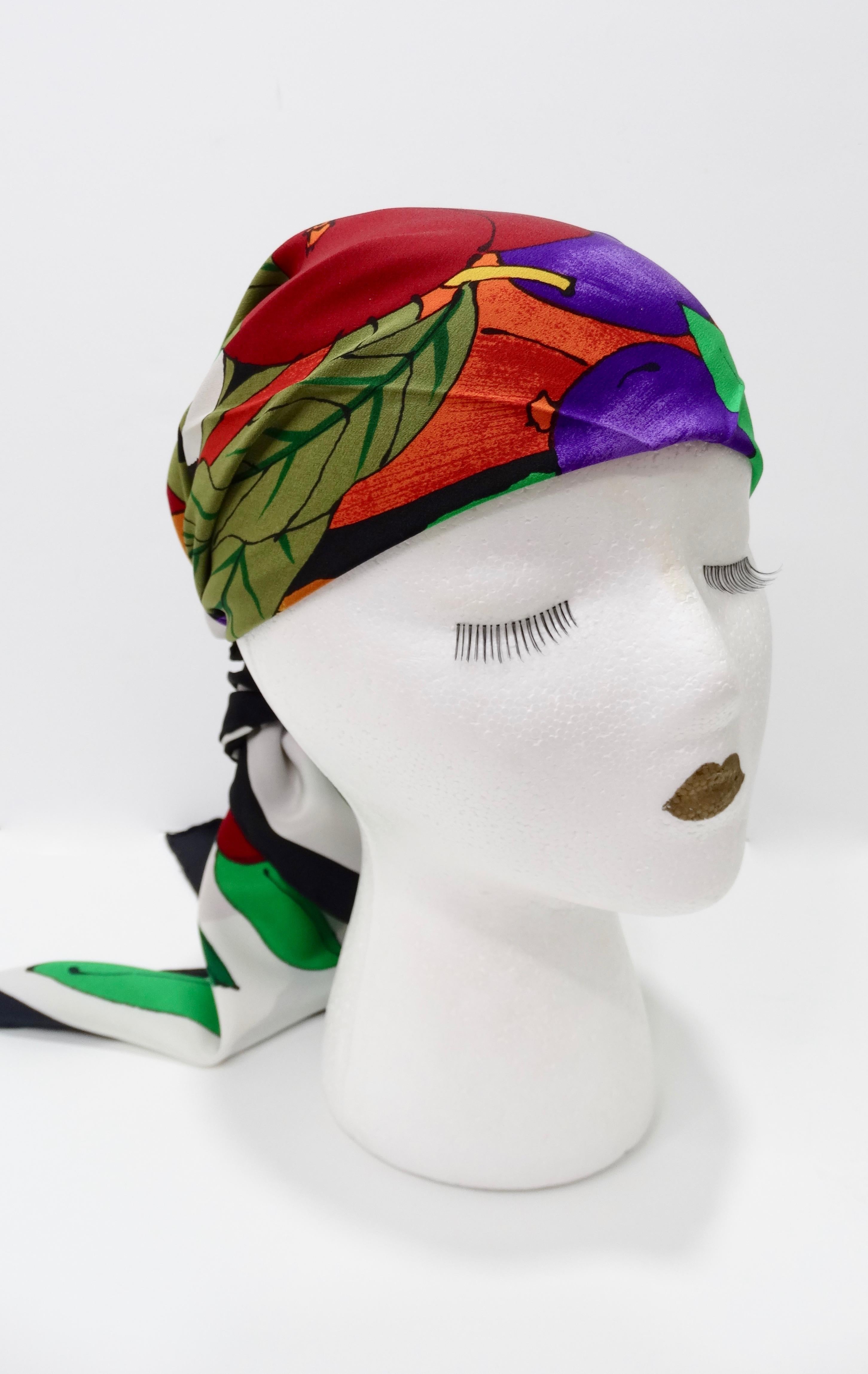 Add some Gucci to your scarf collection! Circa 1980s, this silk scarf features a colorful tropicana motif comprised of pineapples, apples and greenery. Has a black trim and is signed Gucci in the bottom right. Rolled edges. Vibrant and timeless,