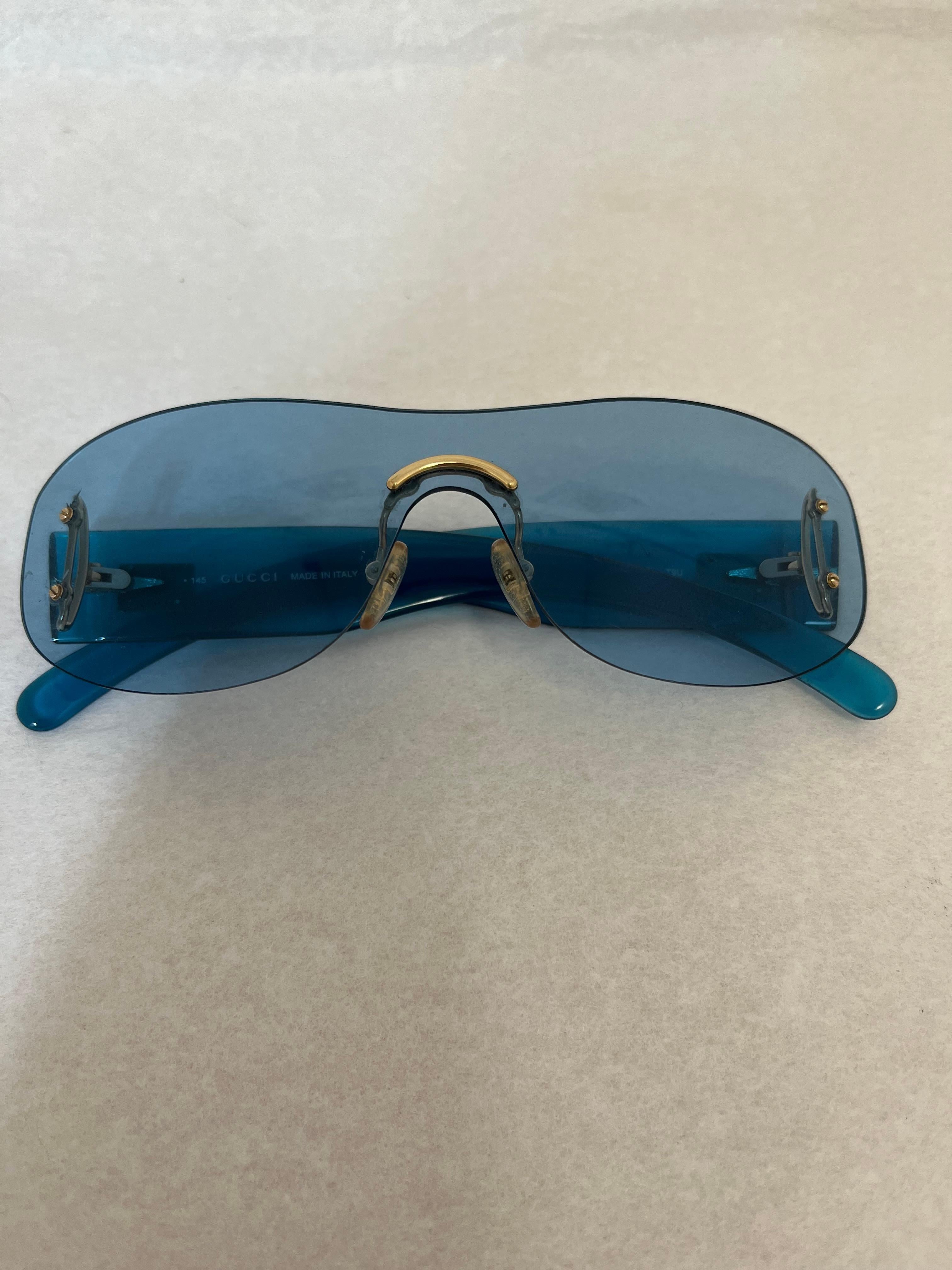 Designed by Tom Ford these blue sunglasses may be from the 1990s but are still much sought after. They are in mint condition and come with a Gucci case.
The model is GG2448/N/S can still be found but at a much higher price.
The side are graced with