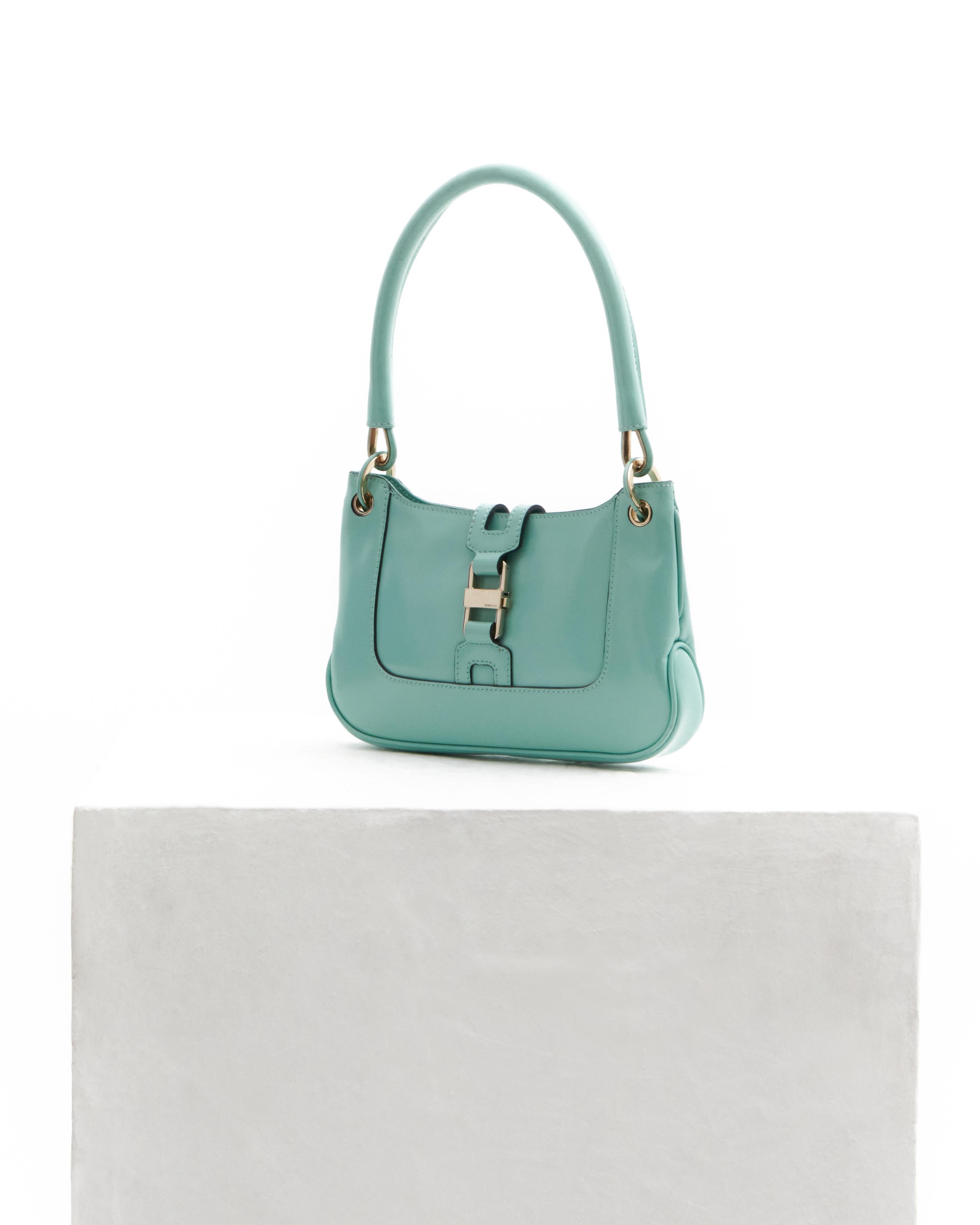 •  Gucci Tiffany 'Jackie' patent leather mini bag
- Sold by Skof.Archive 
- 1990s Period
- Handbag 
- Tiffany patent leather mini 'Jackie' bag
- Silver-tone hardware 
- Inside zipper pocket 
- Secure metal clasp hardware on the exterior and a