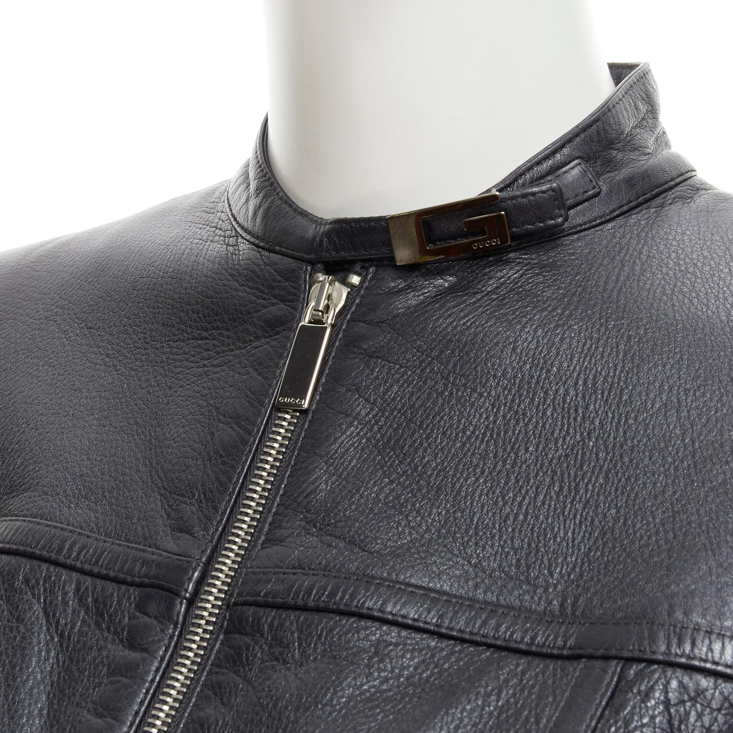 GUCCI 1996 Vintage Tom Ford black leather G logo buckle biker jacket IT40 S 
Reference: GIYG/A00161 
Brand: Gucci 
Designer: Tom Ford 
Collection: Fall Winter 1996 
Material: Leather 
Color: Black 
Pattern: Solid 
Closure: Zip Extra 
Detail: