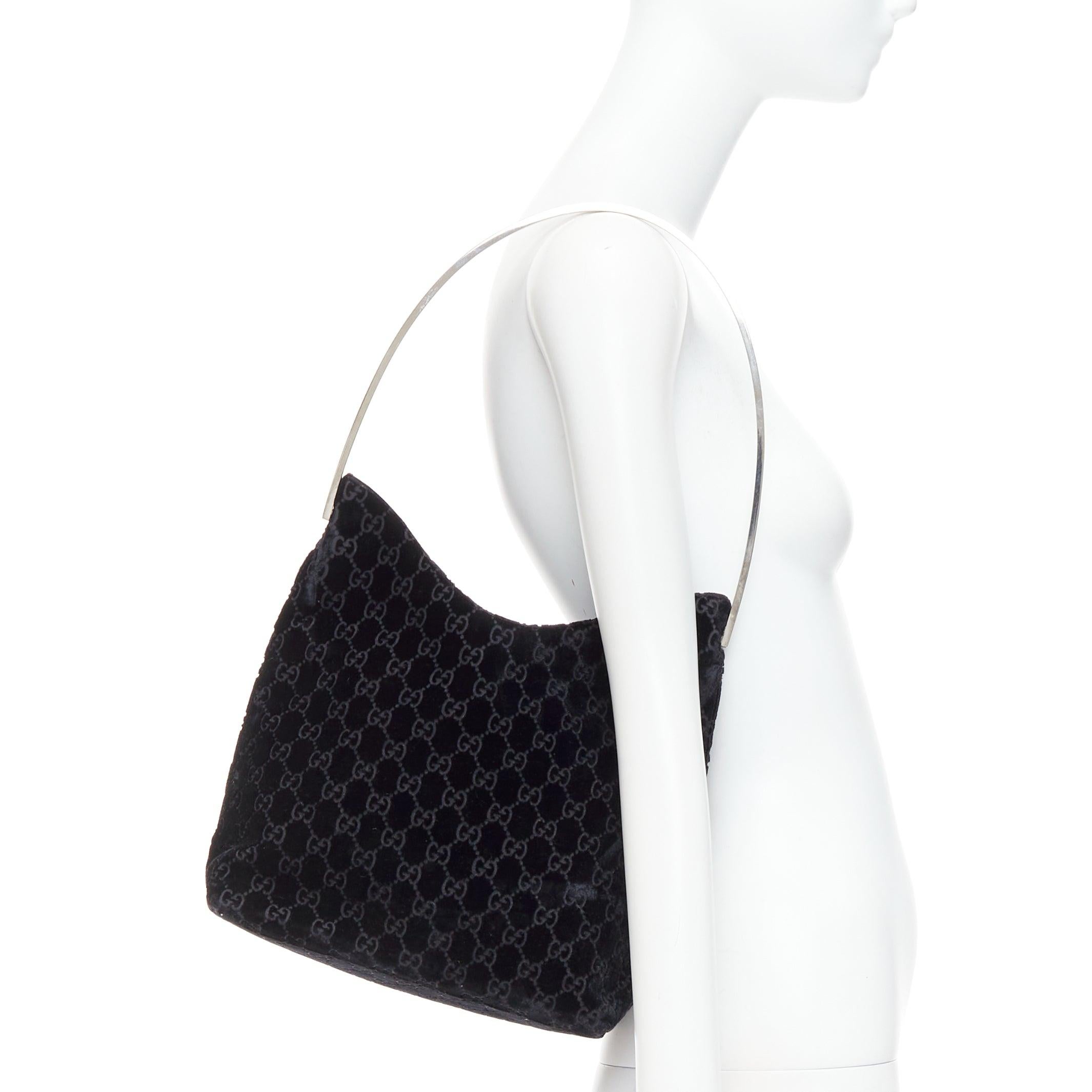 GUCCI 1997 Vintage Tom Ford black velvet GG metal handle underarm bag
Reference: TGAS/E00711
Brand: Gucci
Designer: Tom Ford
Collection: 1997 - Runway
Material: Velvet
Color: Black, Silver
Pattern: Monogram
Lining: Black Fabric
Extra Details: Metal