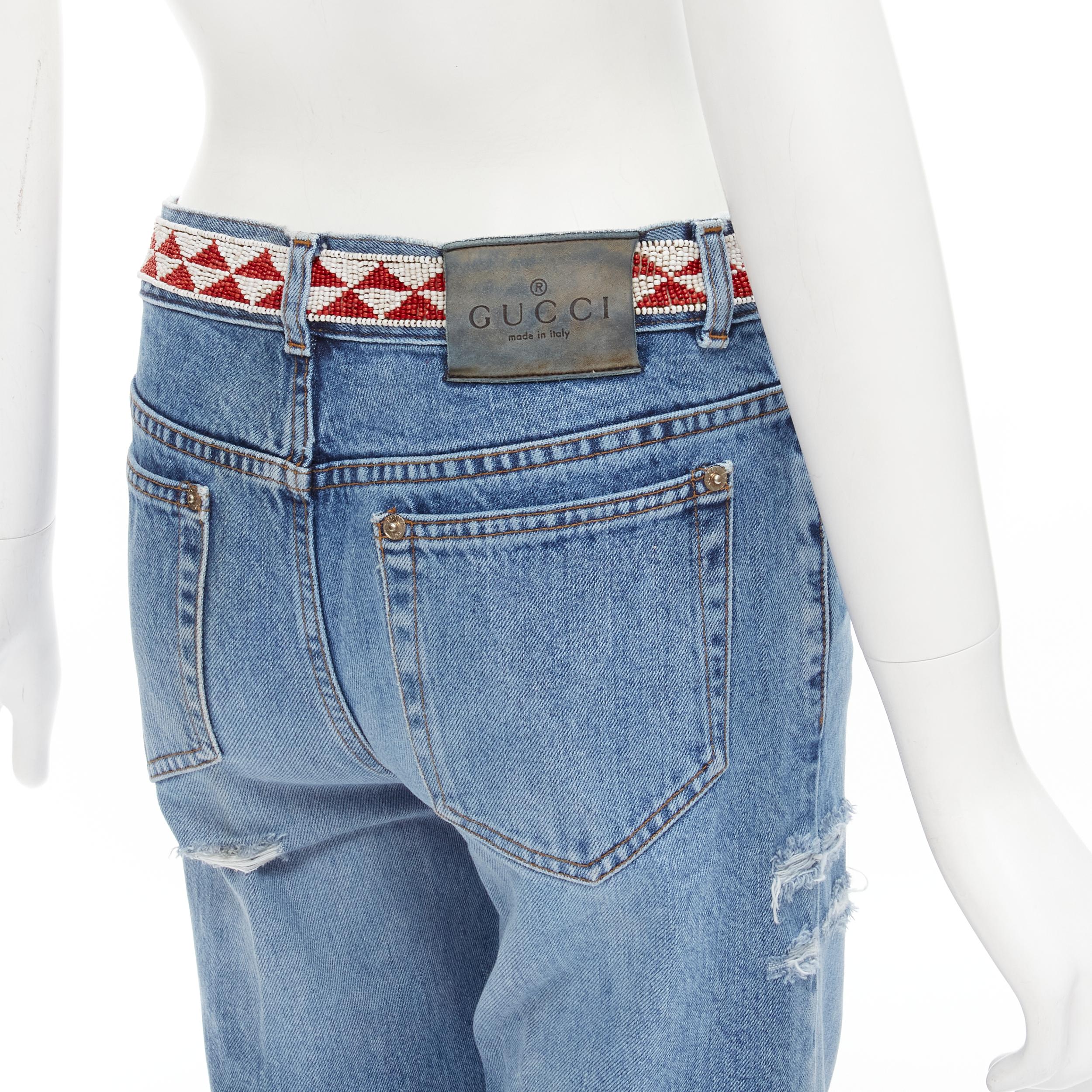 GUCCI 1999 Vintage aztec bead embroidery waist distressed denim jeans IT38 XS 
Reference: ANWU/A00570 
Brand: Gucci 
Collection: 1999 
Material: Denim 
Color: Blue 
Pattern: Solid 
Closure: Zip 
Extra Detail: 5-pocket design. Tribal bead embroidery