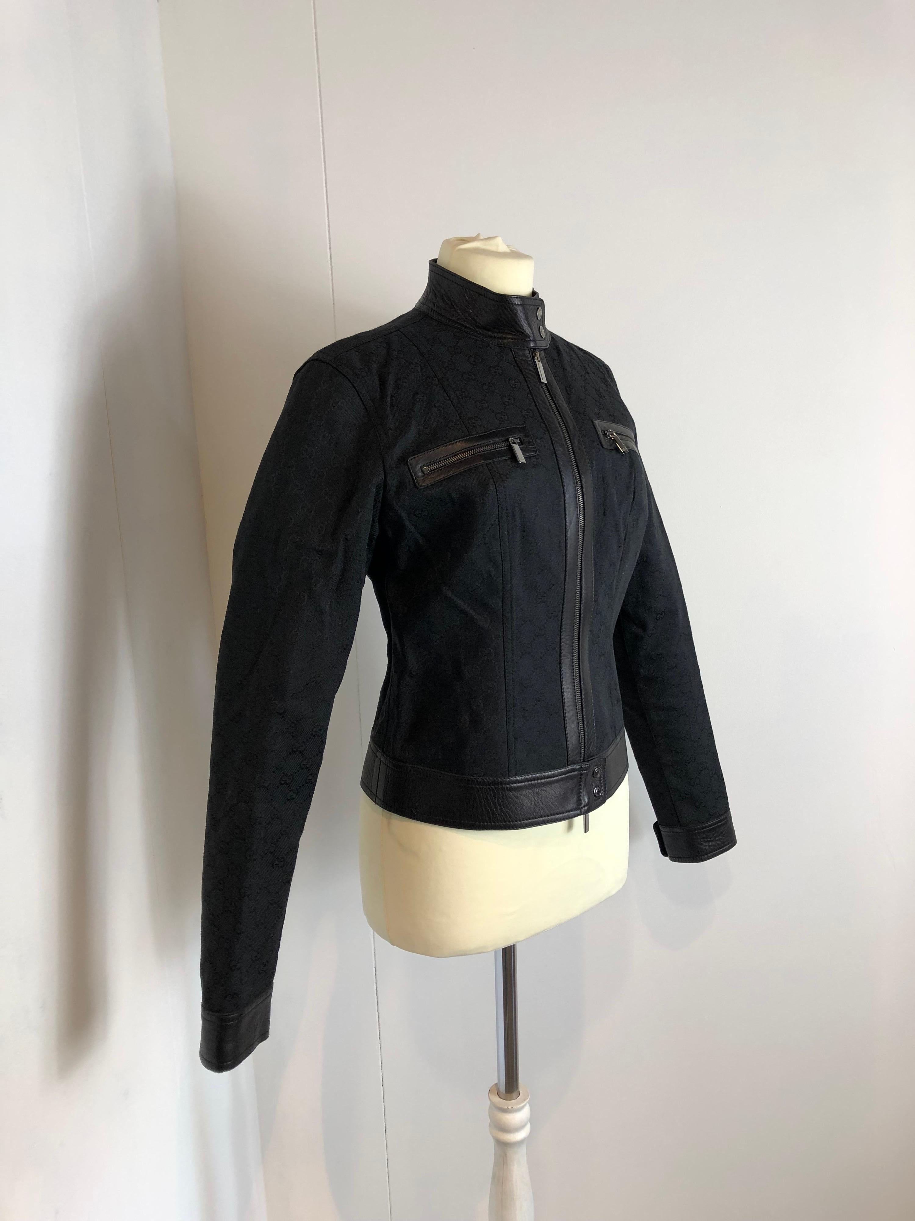 Gucci monogram vintage black jacket.
Coming from 2000 collection by Tom Ford.
Now re proposed by Alessandro Michele during the last fashion show. Iconic piece. 
Fabric is a mix between polyester and cotton. Details in leather. Lining in cupro.