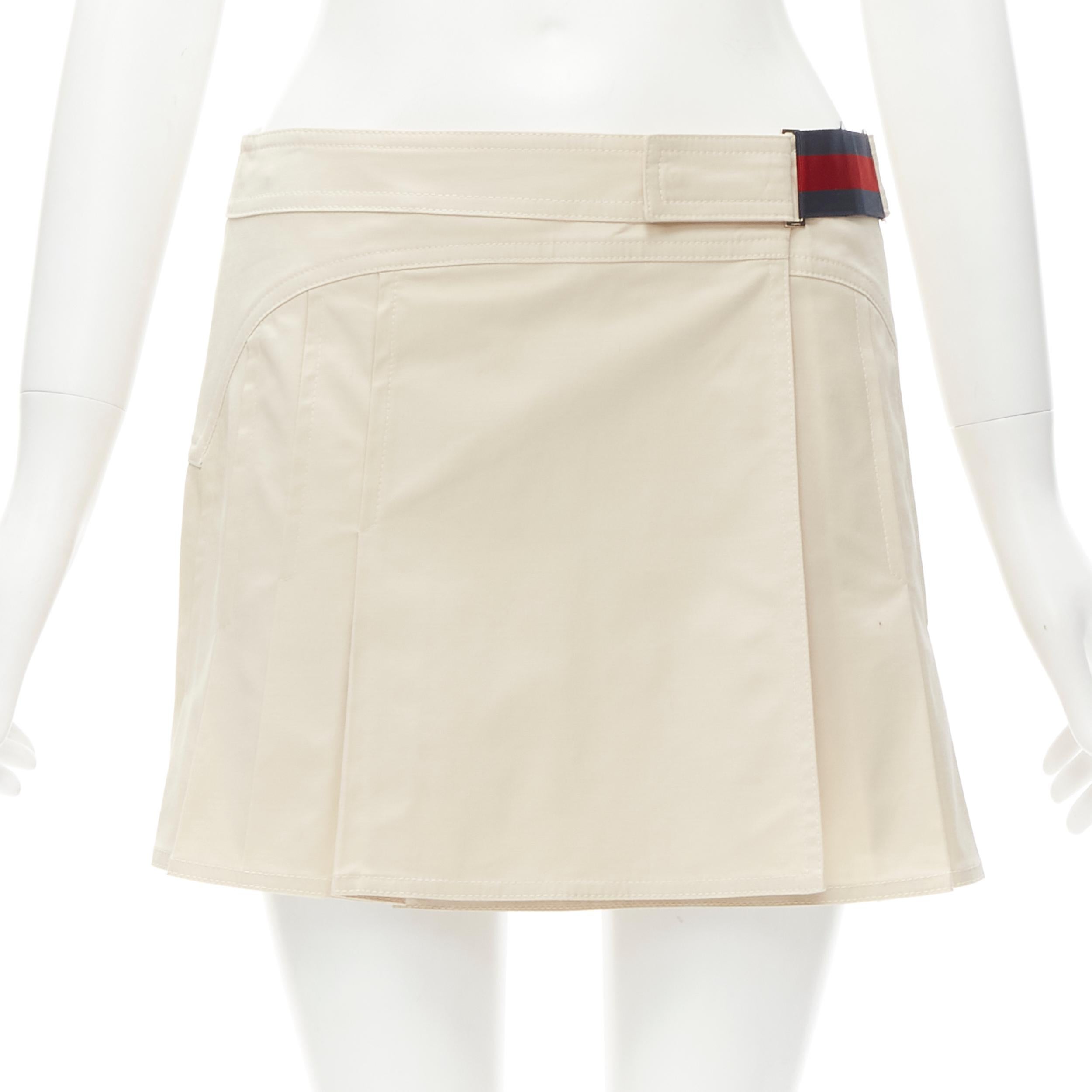 GUCCI 2005 Vintage Y2K Signature web trim beige pleated wrap skirt IT38 XS 
Reference: ANWU/A00563 
Brand: Gucci 
Collection: 2005 
Material: Cotton 
Color: Beige 
Pattern: Solid 
Closure: Button 
Extra Detail: Beige wrap pleated mini skirt.