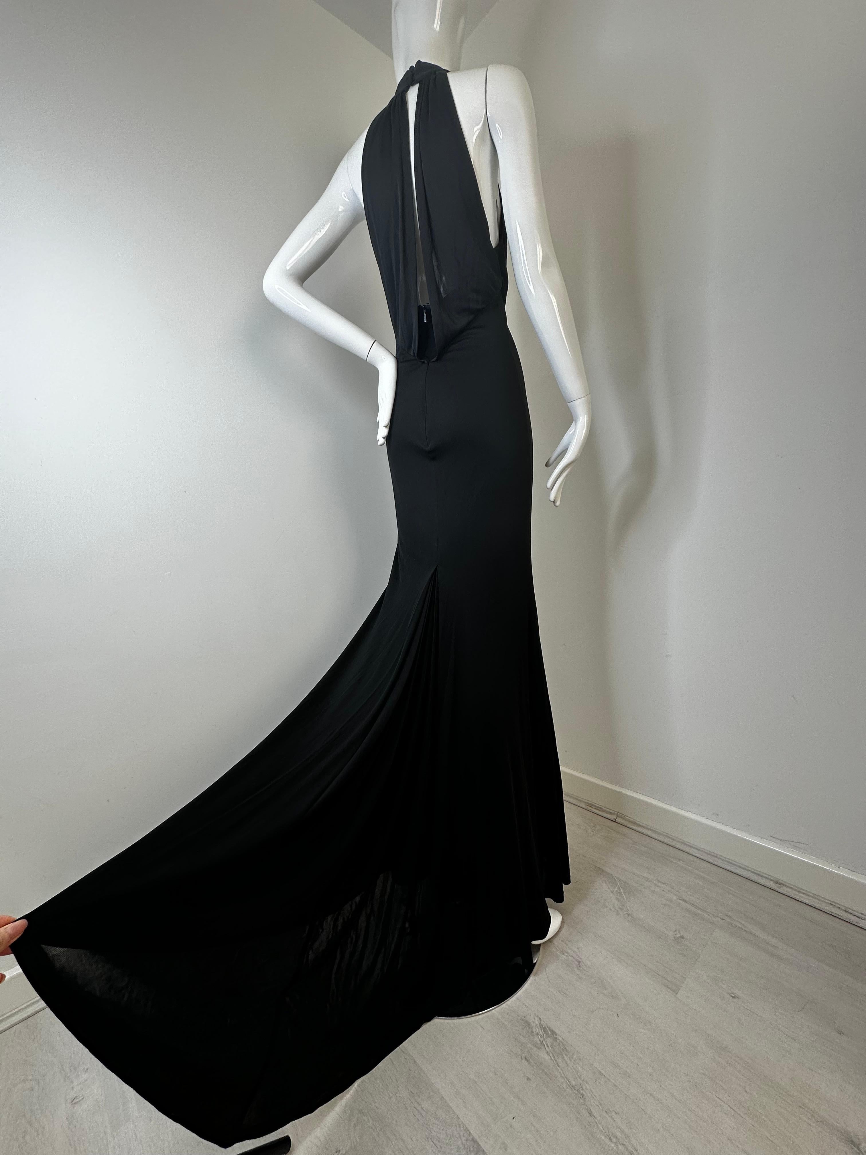 Gucci 2006 black jersey gown with Chrystal GG embellishments and a fishtail in the back 

Size 42 
Zipper in the back 

Great vintage condition, one loose seam underarm but it does not affect the function of the dress