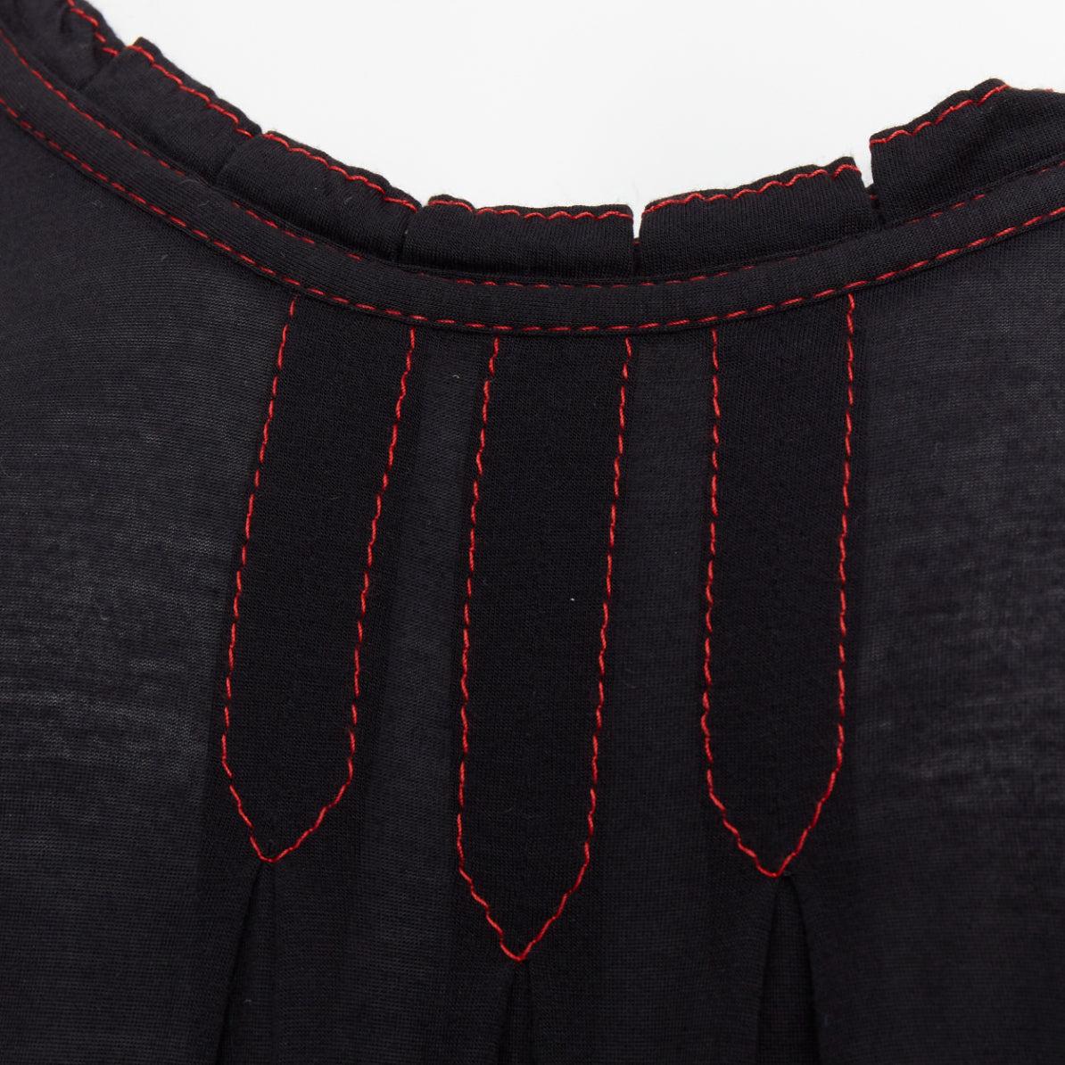 GUCCI 2006 Vintage black red overstitch nylon modal scoop neck plisse top M
Reference: CC/A00433
Brand: Gucci
Collection: 2006
Material: Modal
Color: Black, Red
Pattern: Solid
Closure: Slip On
Extra Details: Ruffled collar.
Made in: