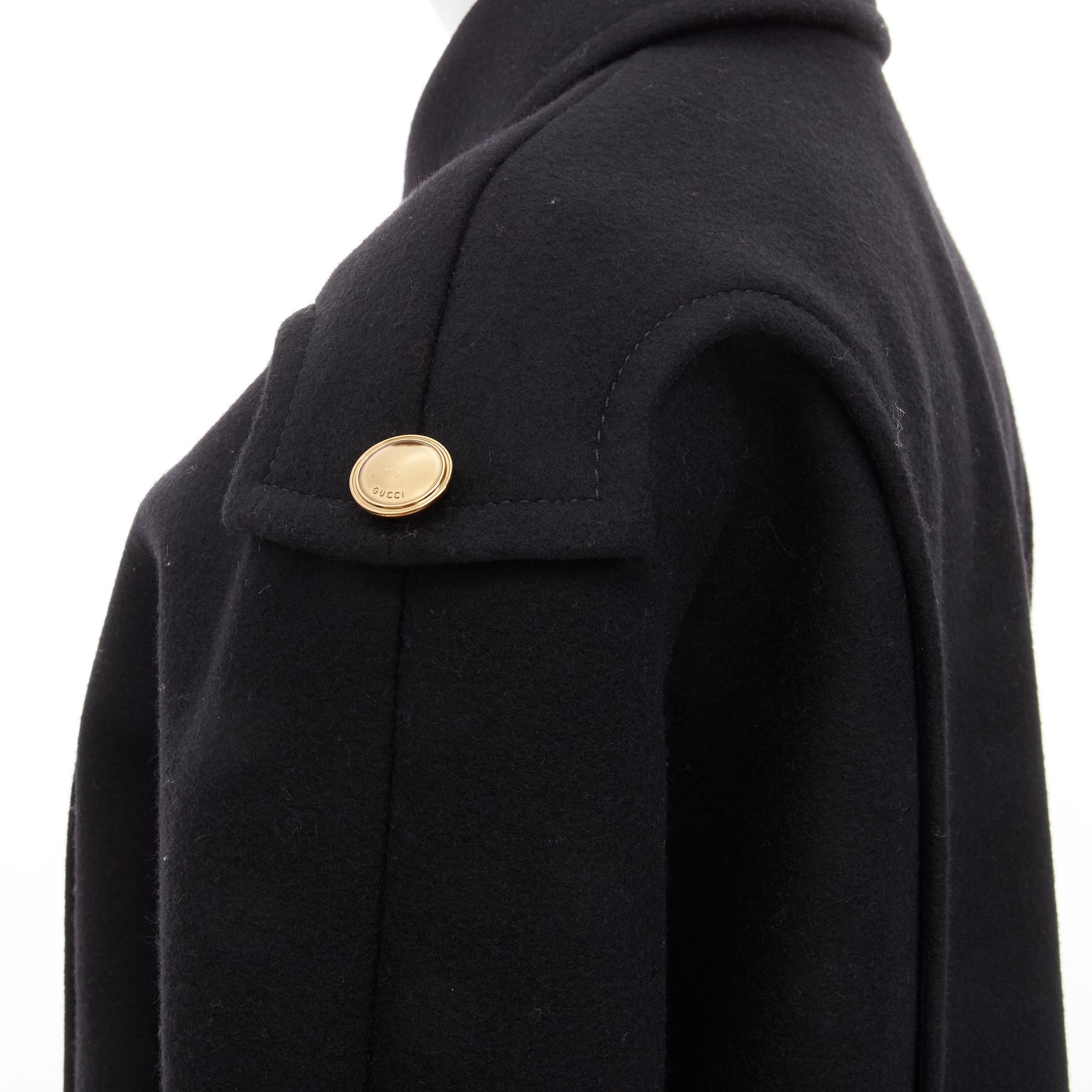 GUCCI 2012 black wool gold buttons zip front cocoon military coat IT38 XS
Brand: Gucci
Collection: 2012 
Material: Wool
Color: Black
Pattern: Solid
Closure: Zip
Extra Detail: Decorative gold-tone Gucci buttons. Double zip front closure. Rounded