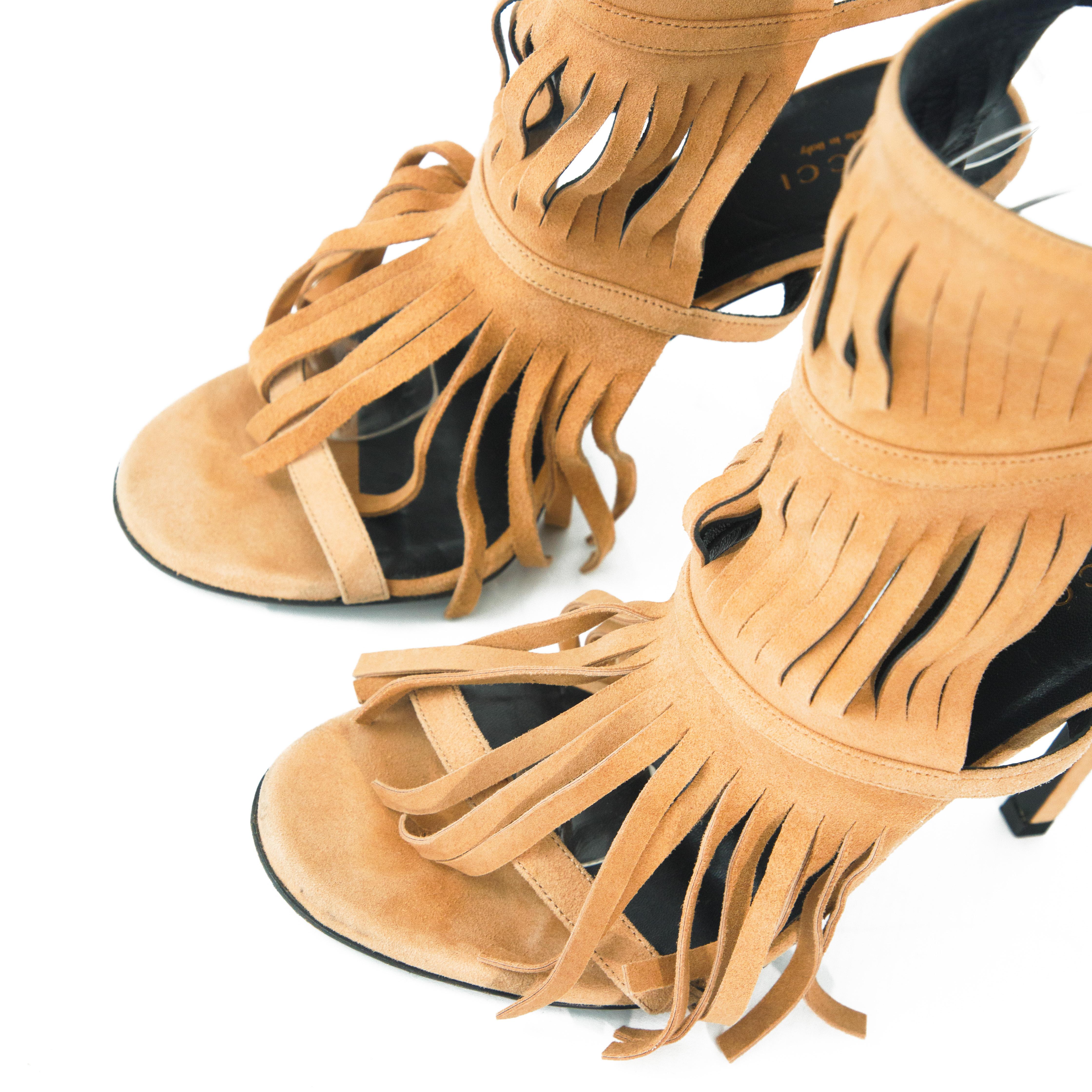 Ruder Than The Rest presents a pair of Gucci 2014 suede fringe gladiator style heels.

This pair comes in light brown suede.

Square shaped stiletto heel.

Sighted on Kenya Moore From The Real Housewives of Atlanta. 

Contemporary vintage,