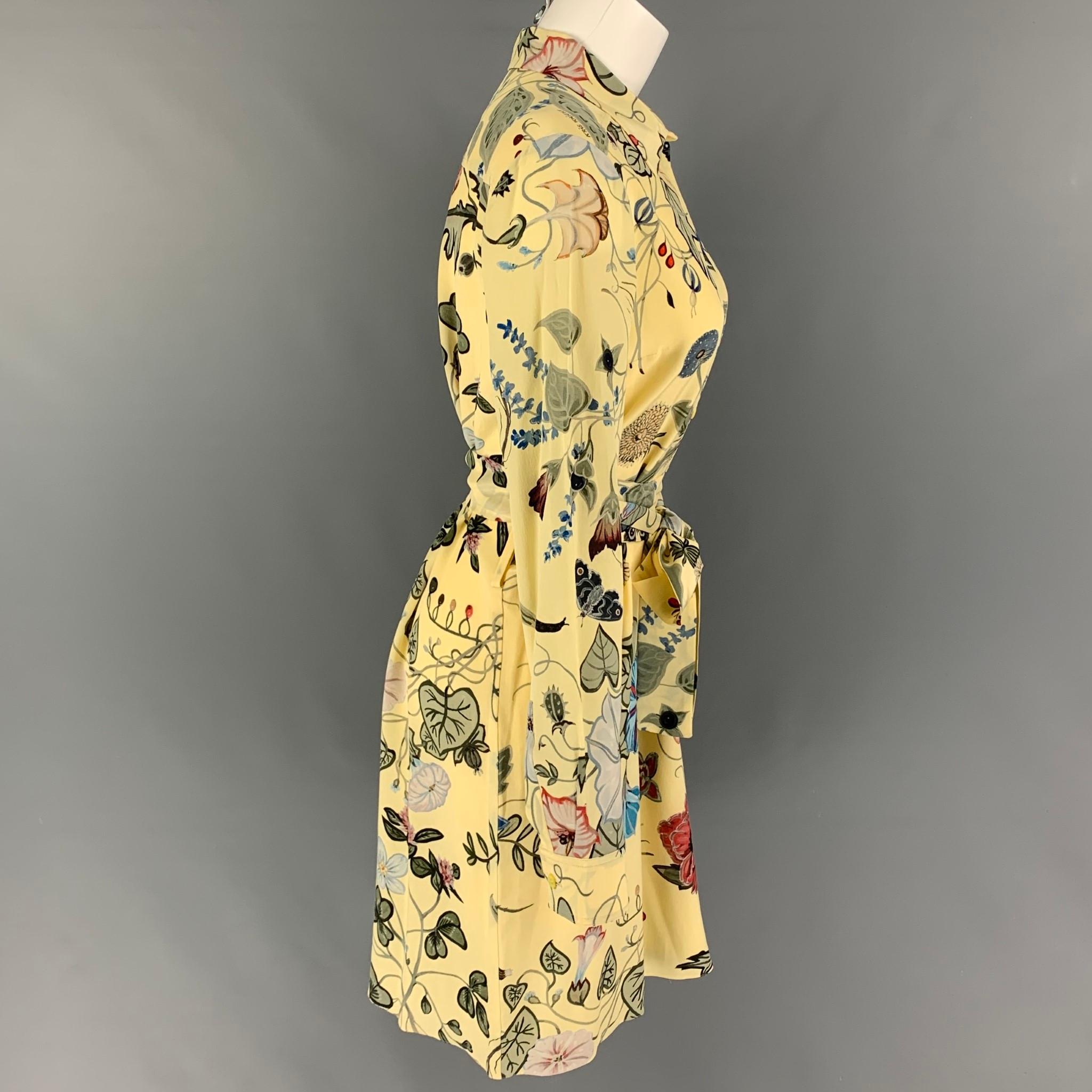 GUCCI 2015 Resort Flora by Kris Knight dress comes in a yellow & green floral silk featuring long sleeves, spread collar, belted, and a half buttoned closure. Made in Italy. 

Very Good Pre-Owned Condition.
Marked: 42

Measurements:

Shoulder: 16