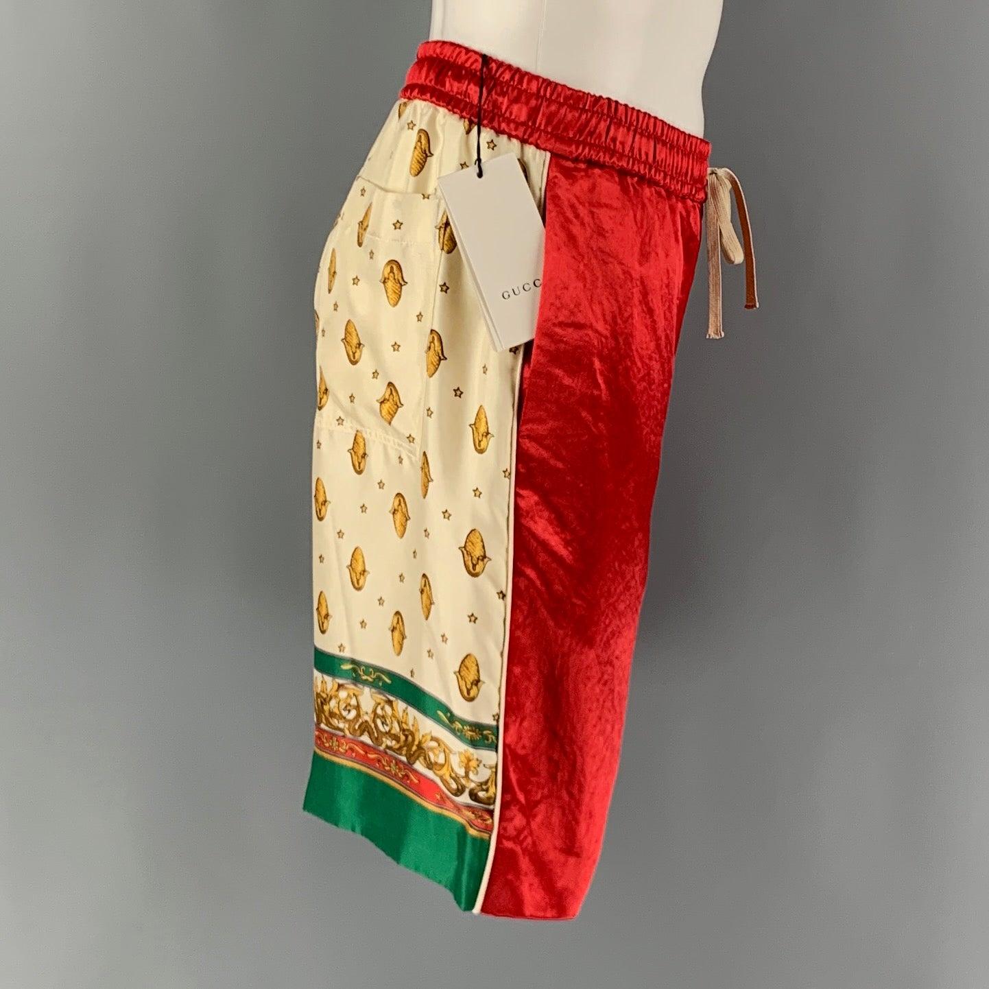 GUCCI 2019 acetate shorts, features a red front, beige and green back with a snake, and stars print. Slit Pockets & Drawstring Closure.
 Made in Italy.New with Tags 

Marked:   46 

Measurements: 
  Waist: 33 inches Rise: 11.5 inInseam: 9.5 inches