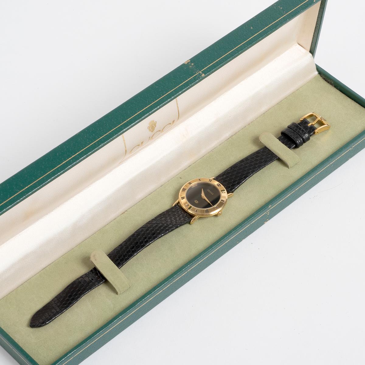 The retro and iconic ladies 1990s Gucci dress watch , reference 3000.2.L, features a gold plated case and desirable black dial. An instantly recognisable dress watch, we date our Gucci 3000.2.L to circa 1990, and it is presented in outstanding