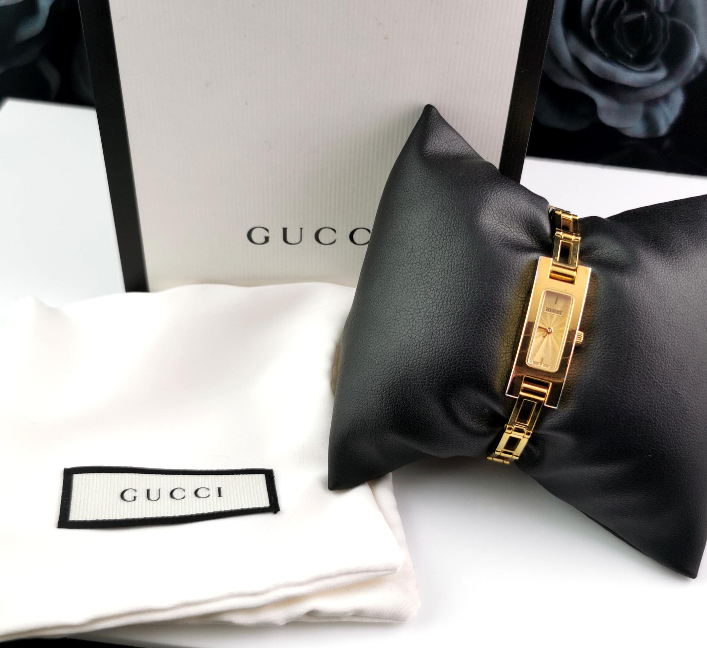 A stylish ladies Gucci 3900l gold plated watch. 

This is a bracelet strap watch with an elegant rectangular shape face and a champagne gold dial. 

Most often come in white and black dial colour so this is a particularly nice one with the gold
