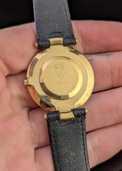 Gucci 4500m mens gold plated wristwatch, leather strap