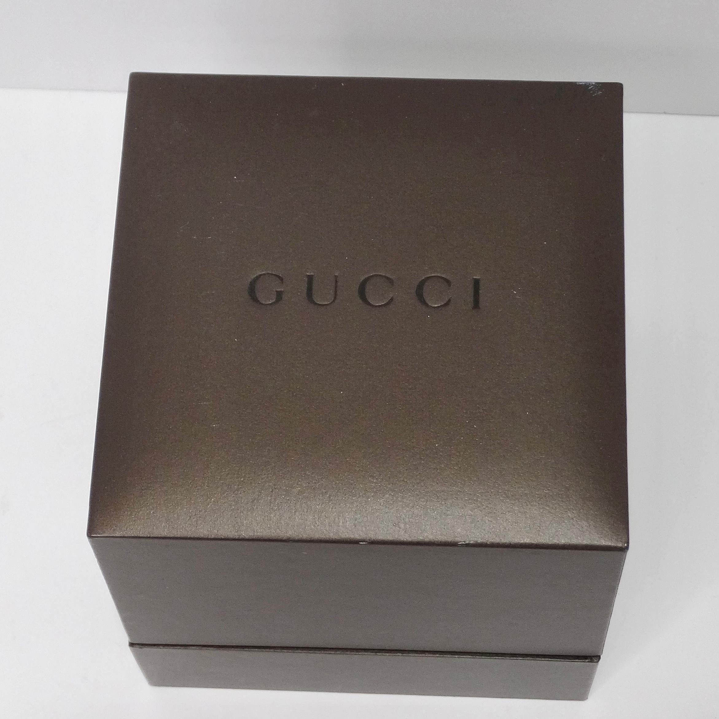 Introducing the exquisite Gucci gold tone watch - a stunning timepiece that exudes luxury and elegance. This brand new watch is expertly crafted from stainless steel, showcasing the impeccable quality that Gucci is renowned for. 
Made in