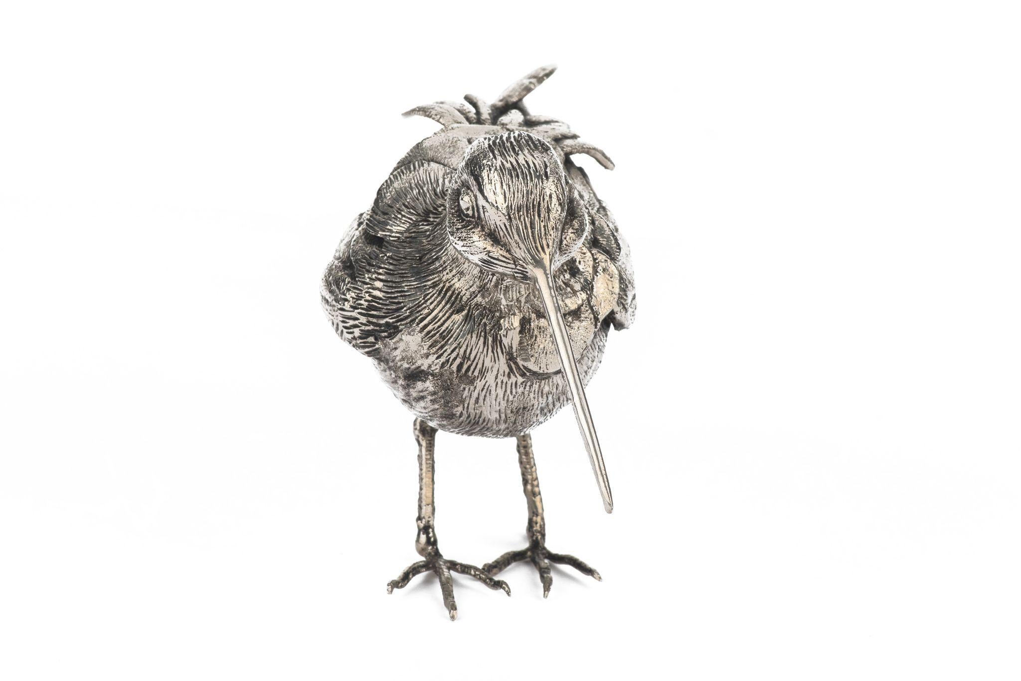 Gucci 1970's collectible woodcock in silver tone metal. Substantial weight and magnificent artifacts, great decorative piece. Excellent condition.