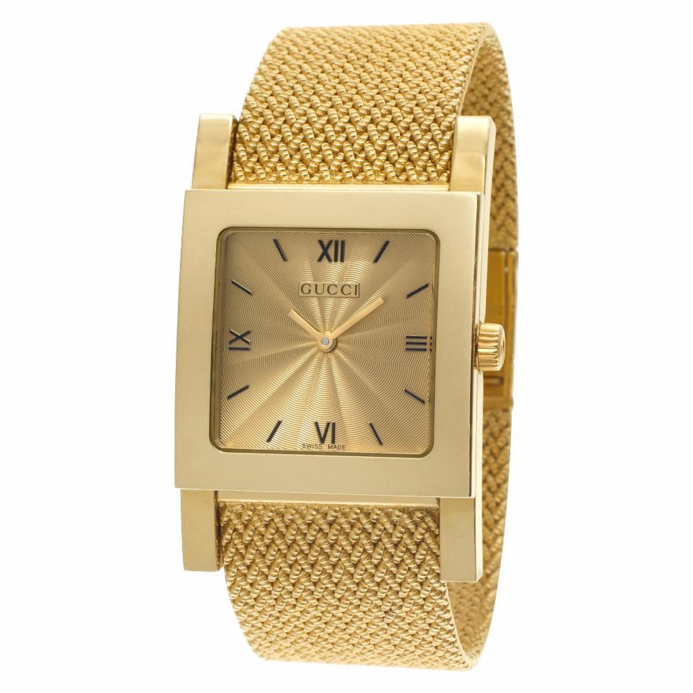 Gucci 7900 M.1 in 18k yellow gold on a mesh band. Quartz. Circa 2000s. Fine Pre-owned Gucci Watch. Certified preowned Dress Gucci 7900 M.1 watch is made out of yellow gold on a 18k bracelet with a 18k Clasp buckle. This Gucci watch has a 29 x 29 mm