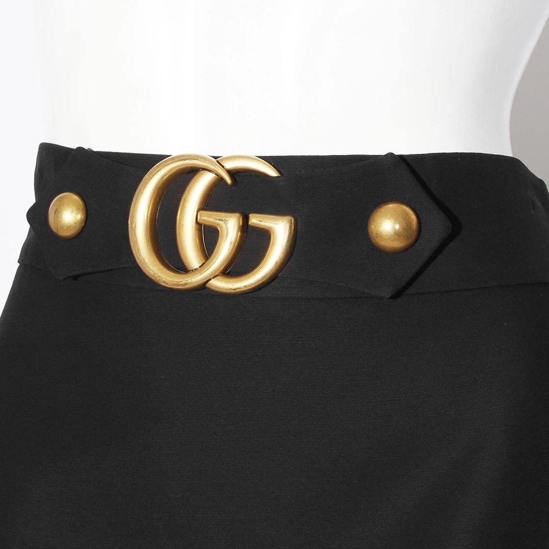 Gucci by Alessandro Michele A-Line Skirt 
Made in Italy 
Produced in 2018 
Black 
Brass large GG logo and rounded stud hardware at waistline 
Invisible zipper down left side of skirt 
Fabric composition; 51% Wool 49% Silk 
Interior lined in black