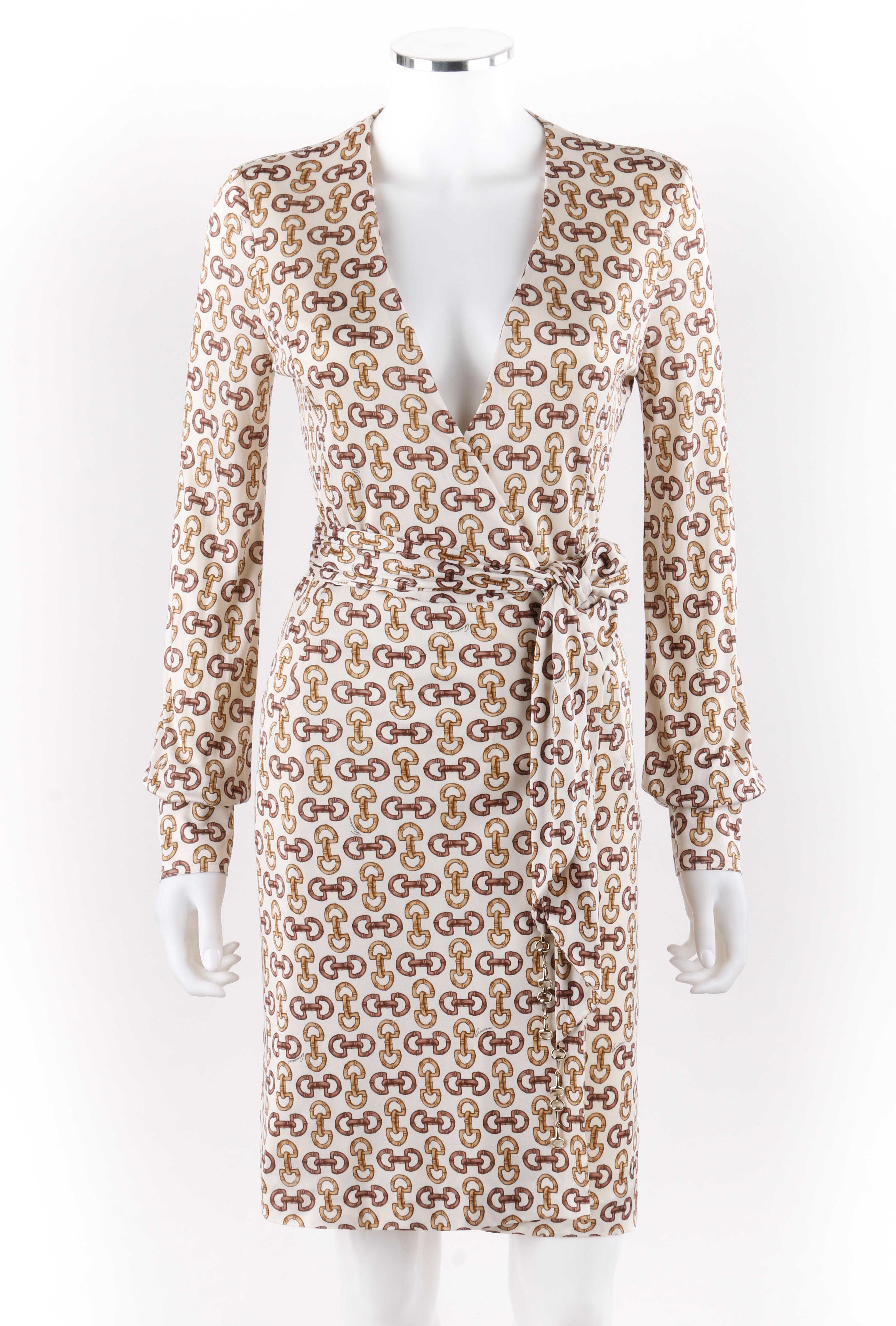 GUCCI A/W 2005 Horsebit Equestrian Bridle Belted Silk Classic Wrap Dress
  
Brand / Manufacturer: Gucci
Collection: Autumn / Winter 2005
Designer: Alessandra Facchinetti
Style: Wrap dress
Color(s): Light beige (exterior, interior), shades of gold,