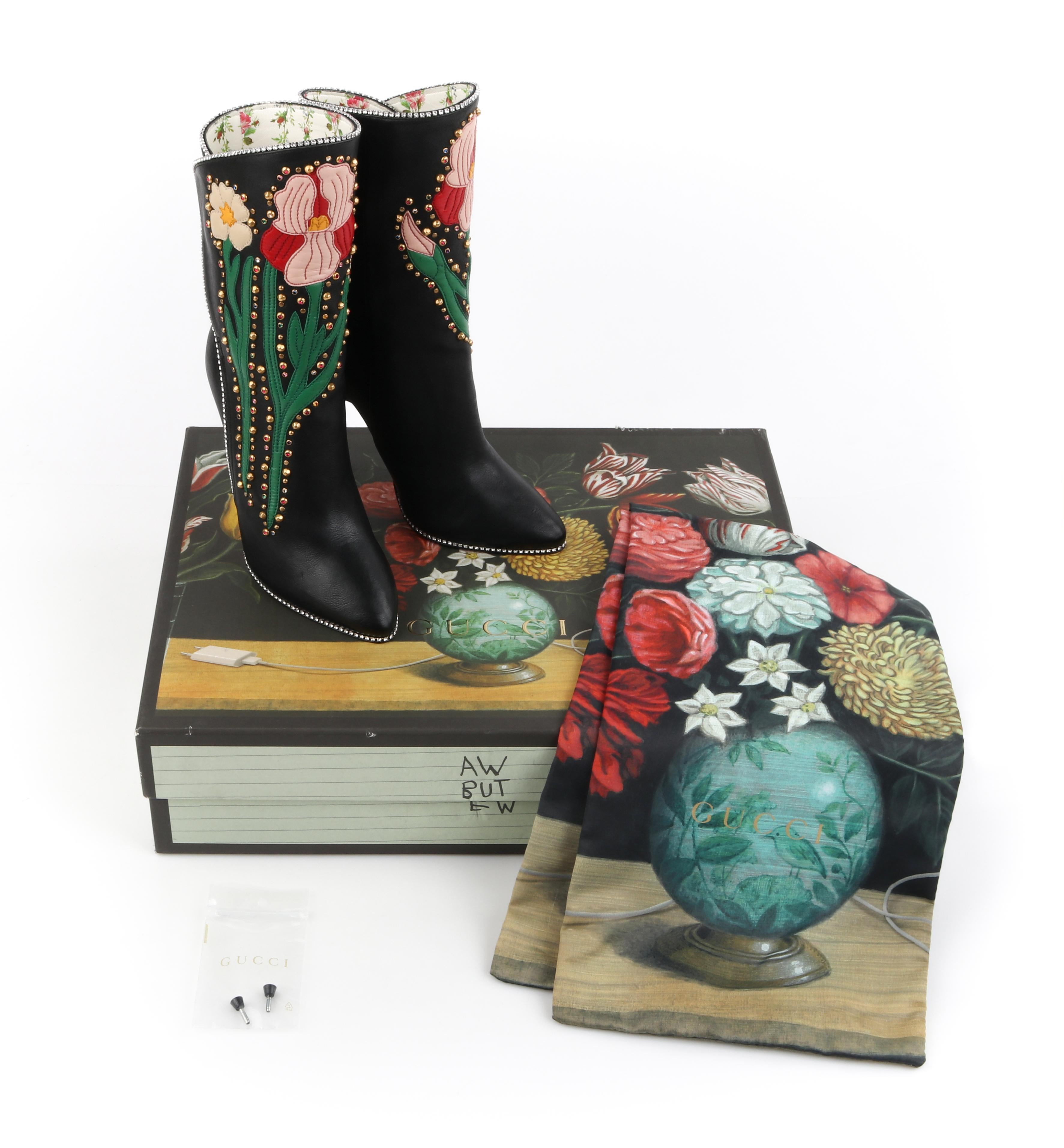 GUCCI A/W 2017 “Fosca” Black Floral Applique Studded Crystal Leather Stiletto Boots
 
Estimated Retail: $2,390
 
Brand / Manufacturer: Gucci 
Designer: Alessandro Michele
Collection: Autumn / Winter 2017; Runway look #71
Manufacturer Style Name: