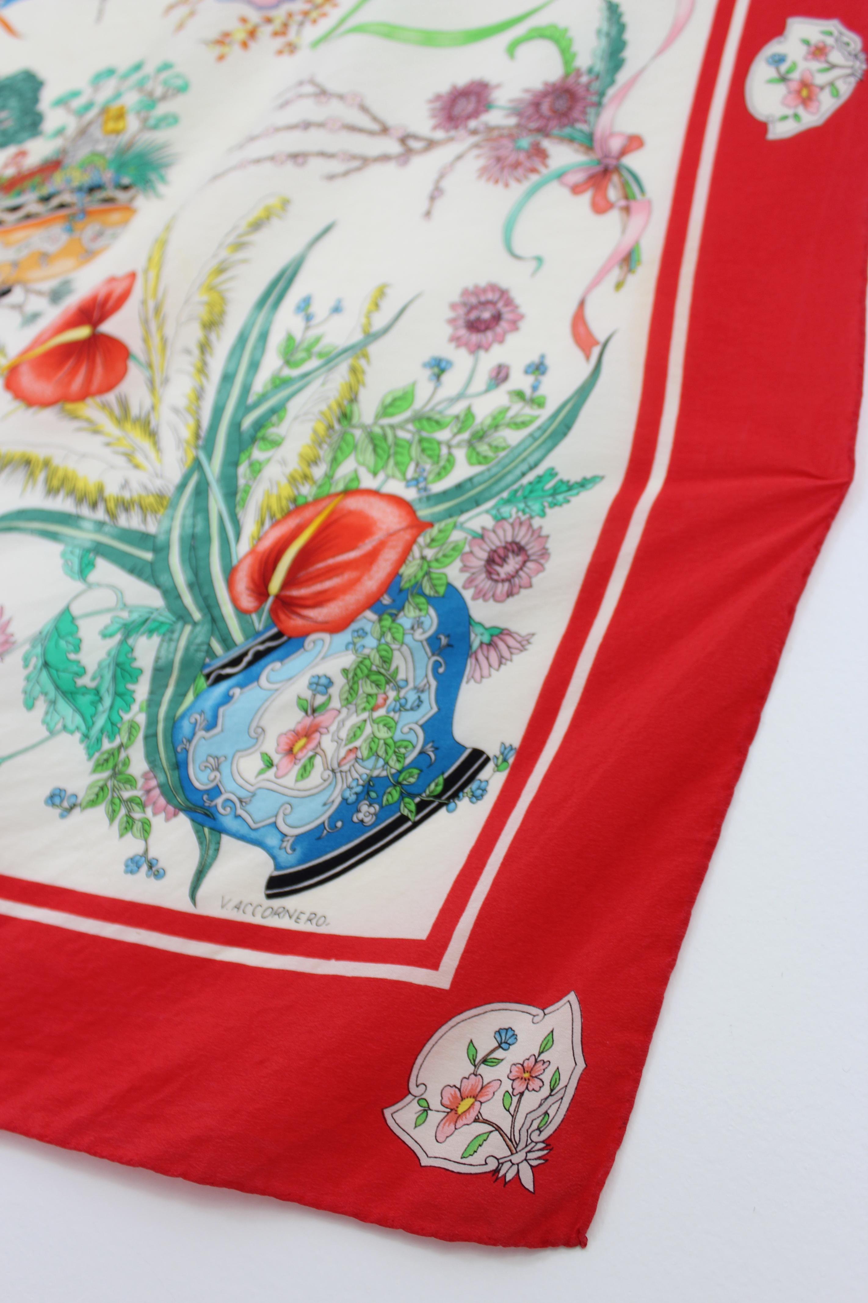 Gucci Accornero vintage 70s scarf. Red and beige foulard, colorful floral designs. 100% silk fabric. Made in Italy. Good vintage condition, some stains due to use over time.

Measures: 86 x 83 cm