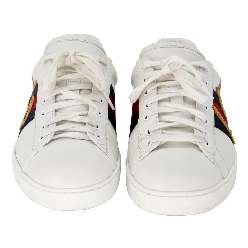 Gucci Ace Gg Low Tops 10.5 Gold Stitching Sneakers GG-0903N-0001

The 'LOVED' inspired Ace sneaker is reinvented with signature web design and amazing LOVED stitching design. These are perfect for daily use or upgrade any look. The shoes includes