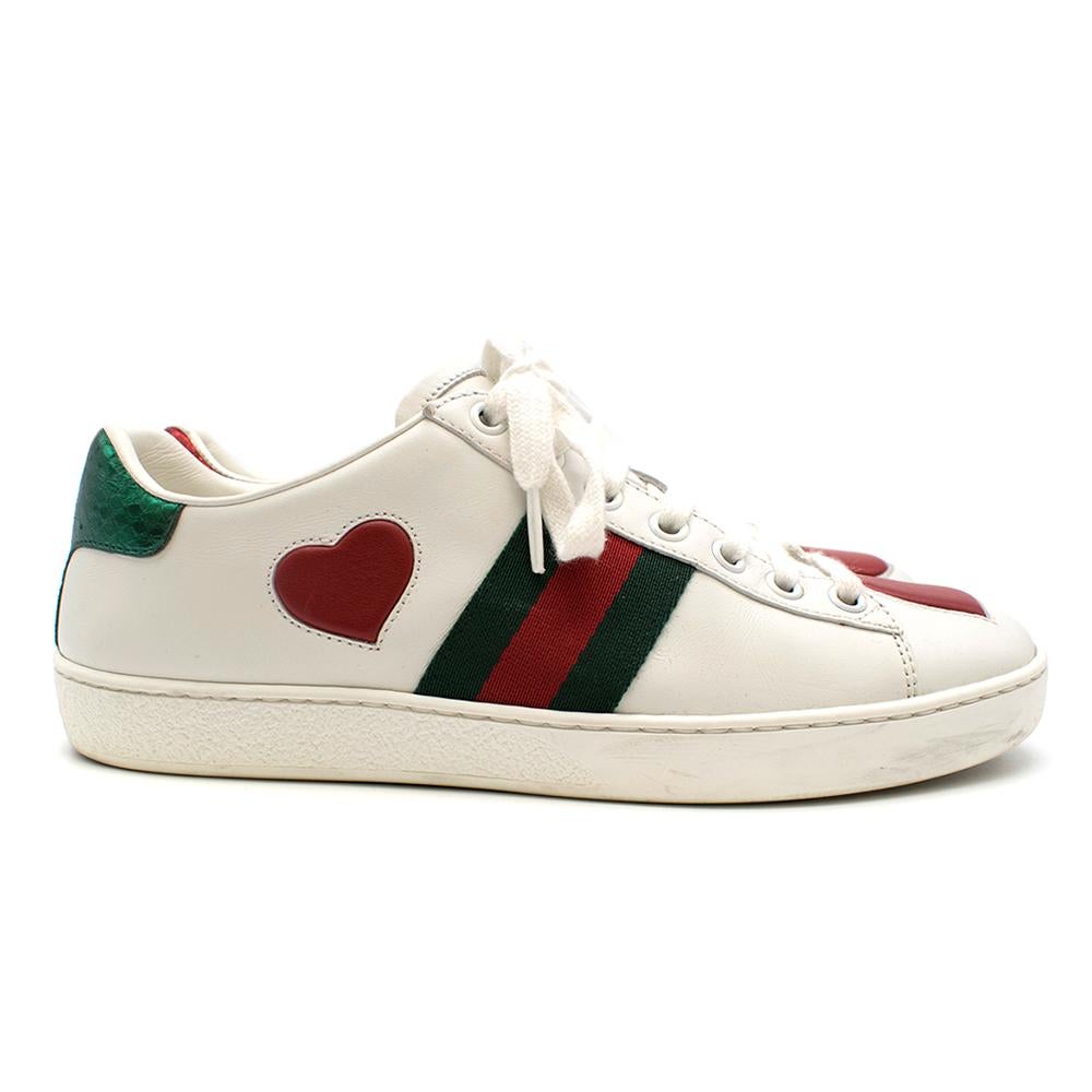 Gucci Ace Heart Embroidered Sneakers

Red and green metallic watersnake detail on heel
Leather hearts on toe and outside of shoe
Iconic Gucci Web on inside and outside of foot
Fabric laces (in good condition)

Please note, these items are pre-owned