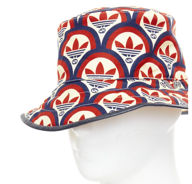 GUCCI ADIDAS 2022 logo print leather trim bucket hat
Reference: BNAY/A00021
Brand: Gucci
Designer: Alessandro Michele
Collection: Adidas
Material: Fabric, Leather
Color: Red, Black
Pattern: Logomania
Lining: Cream Fabric
Made in: