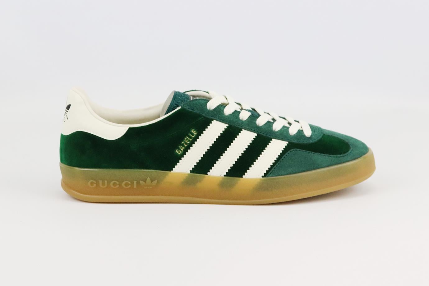 Gucci + Adidas Gazelle velvet and suede sneakers. Green and white. Lace up fastening at front. Comes with dustbag. Size: EU 40 (UK 7, US 10). Insole: 10.5 in. Heel: 1 in
