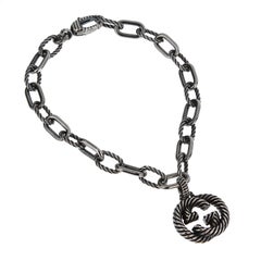 Bracciale a catena con G intrecciata in argento 925 invecchiato di Gucci - 7 1/4"