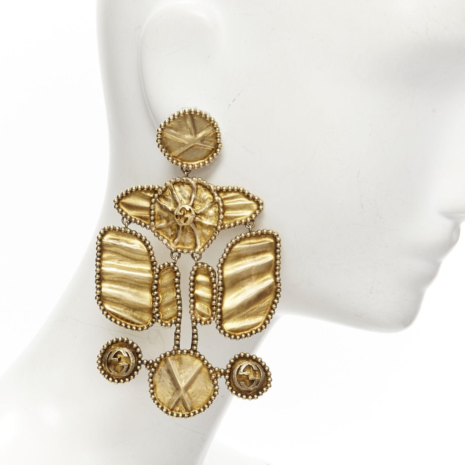 GUCCI ALESSANDRO MICHELE antique gold tone aboriginal tribal GG clip on earrings
Reference: TGAS/C01504
Brand: Gucci
Designer: Alessandro Michele
Model: 603502 I4600 0721
Collection: Runway
Material: Metal
Color: Gold
Pattern: Solid
Closure: Clip